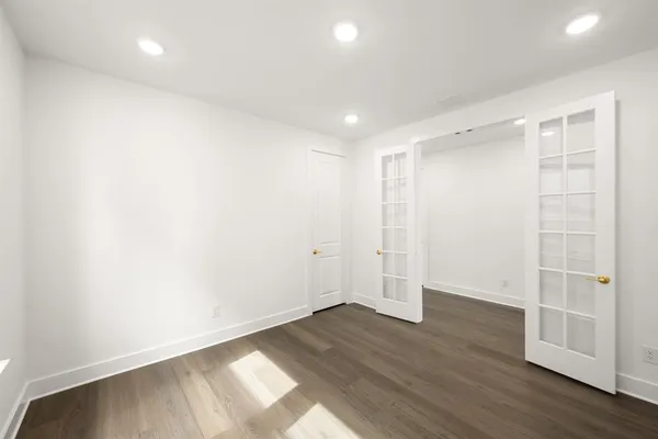an empty room with wooden floor