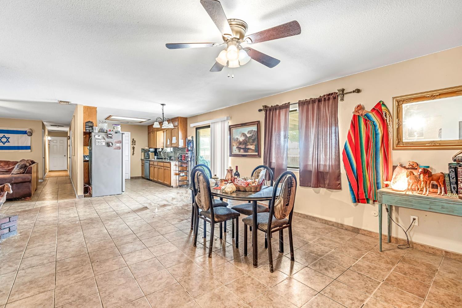 30550 Ave 20 1/2 Madera, CA 93638 - Photo 11 of 24 a view of a dining room with furniture