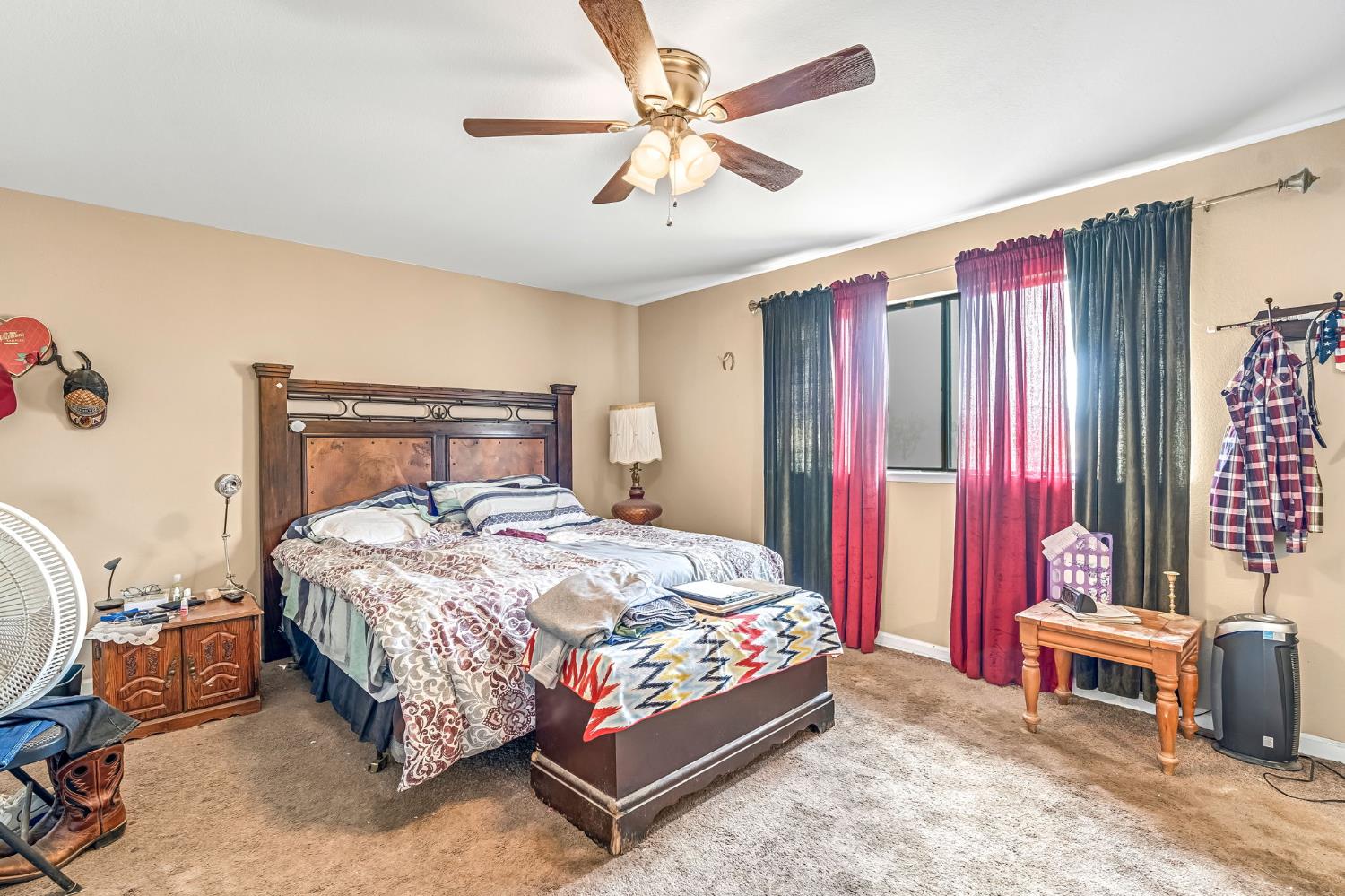 30550 Ave 20 1/2 Madera, CA 93638 - Photo 13 of 24 a bedroom with a bed and a chandelier