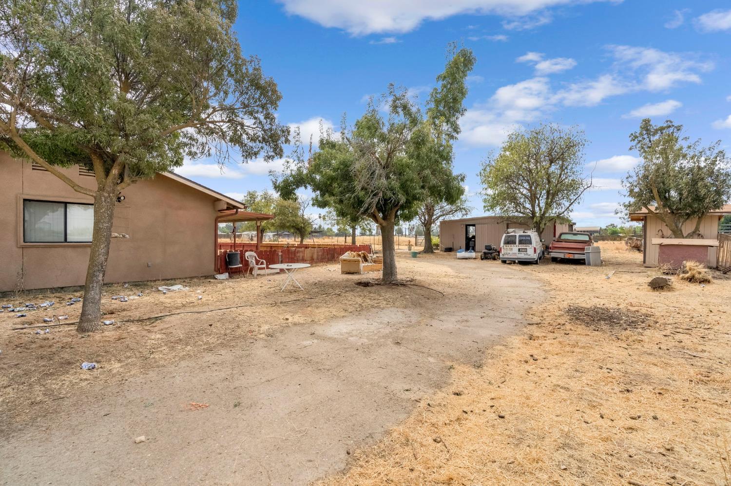30550 Ave 20 1/2 Madera, CA 93638 - Photo 15 of 24 a view of street with parked cars