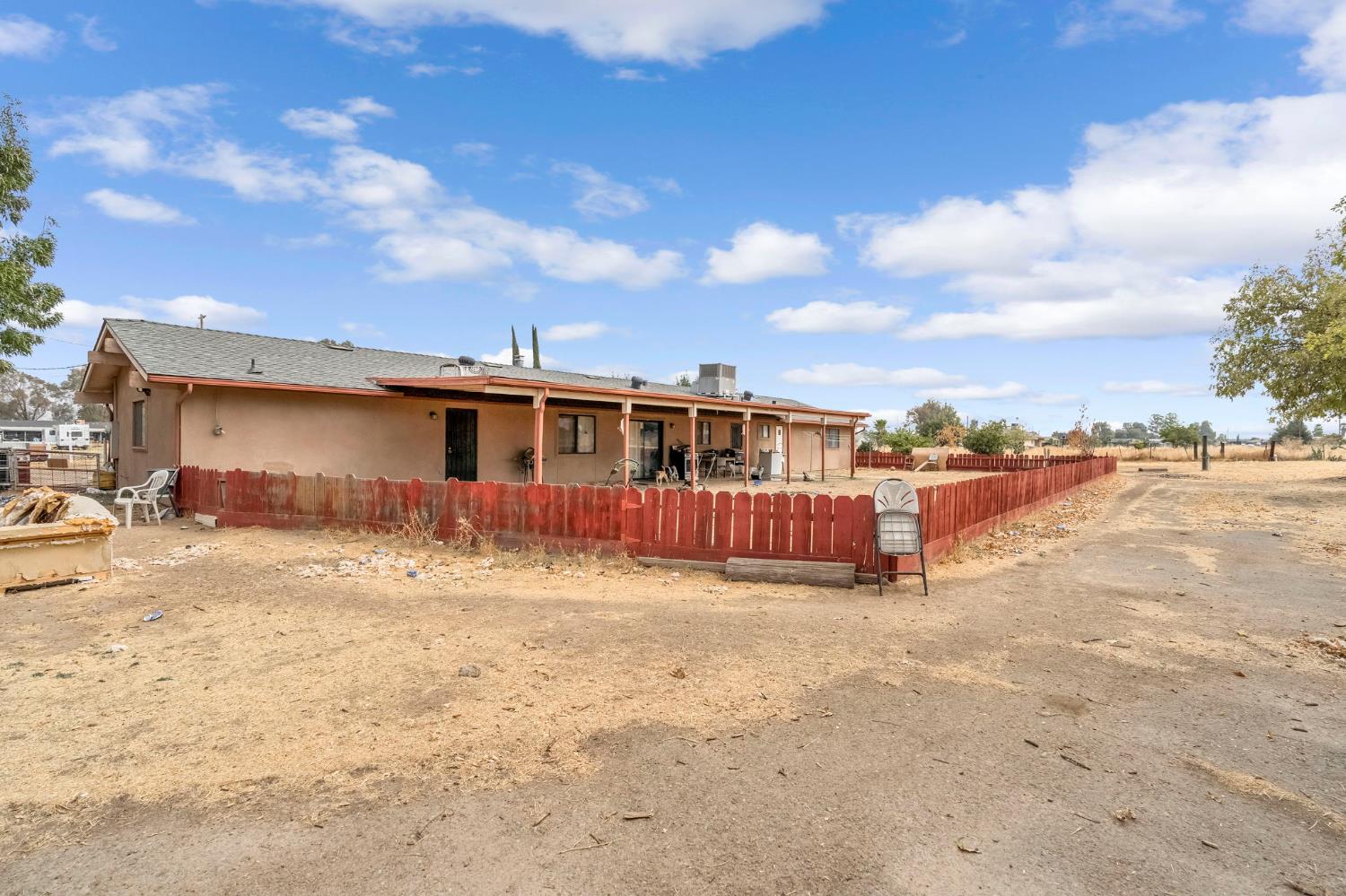 30550 Ave 20 1/2 Madera, CA 93638 - Photo 17 of 24 a view of a house with a yard
