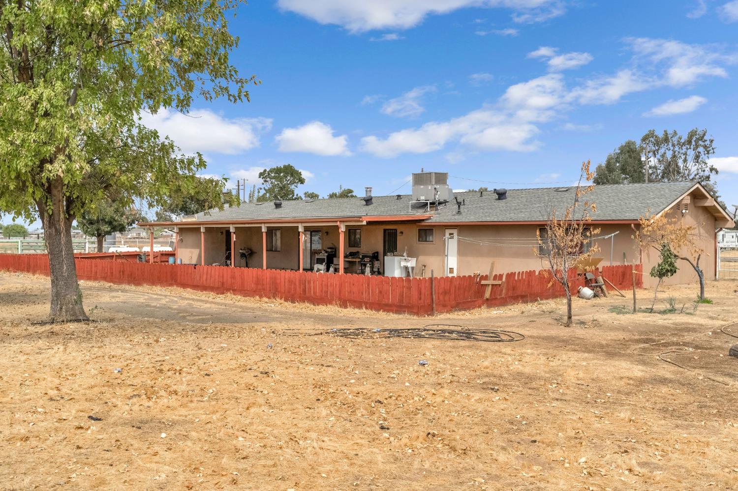 30550 Ave 20 1/2 Madera, CA 93638 - Photo 21 of 24 a view of a house with a yard