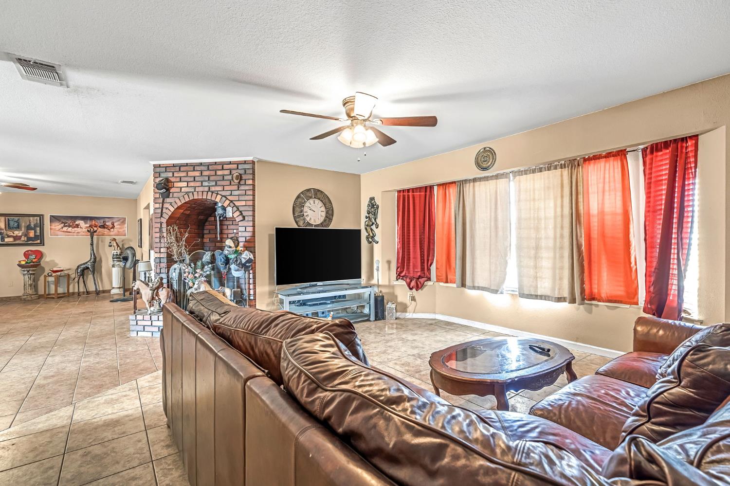 30550 Ave 20 1/2 Madera, CA 93638 - Photo 6 of 24 a living room with furniture and a flat screen tv