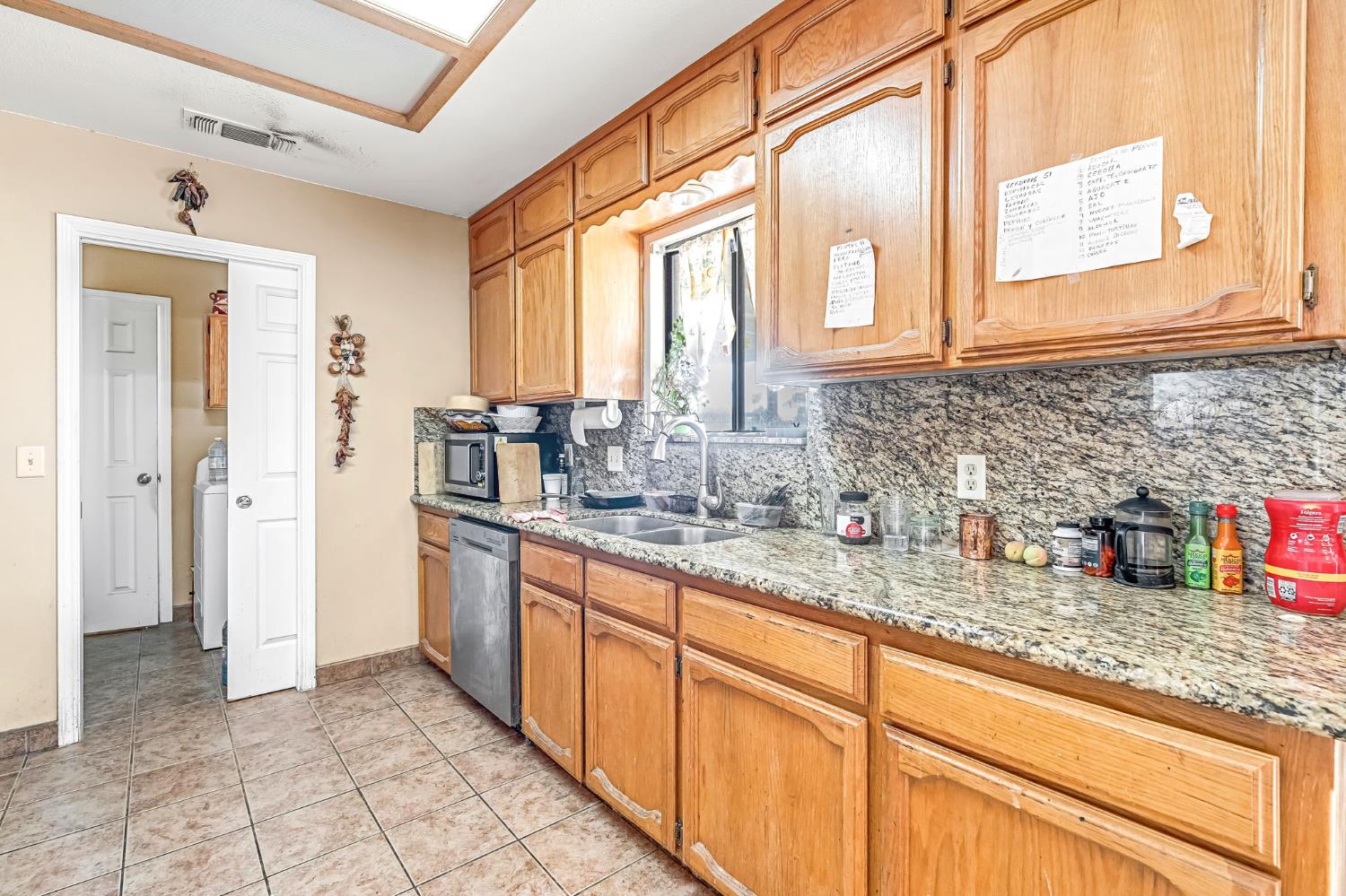 30550 Ave 20 1/2 Madera, CA 93638 - Photo 10 of 24 a kitchen with stainless steel appliances granite countertop a sink and a cabinets