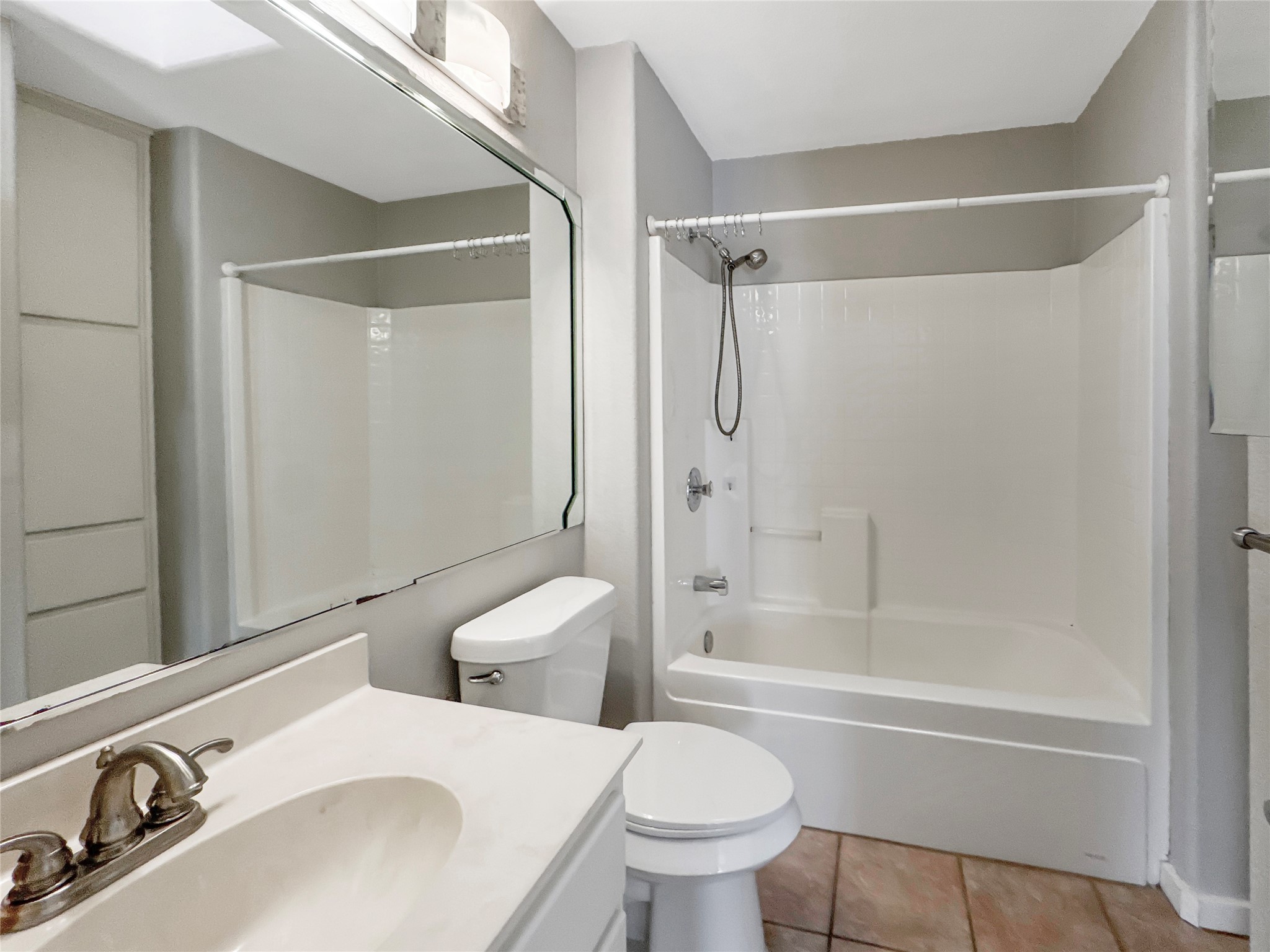2114 Goodrich Avenue, Unit 4 Austin, TX 78704 - Photo 13 of 24 a bathroom with a sink toilet and shower