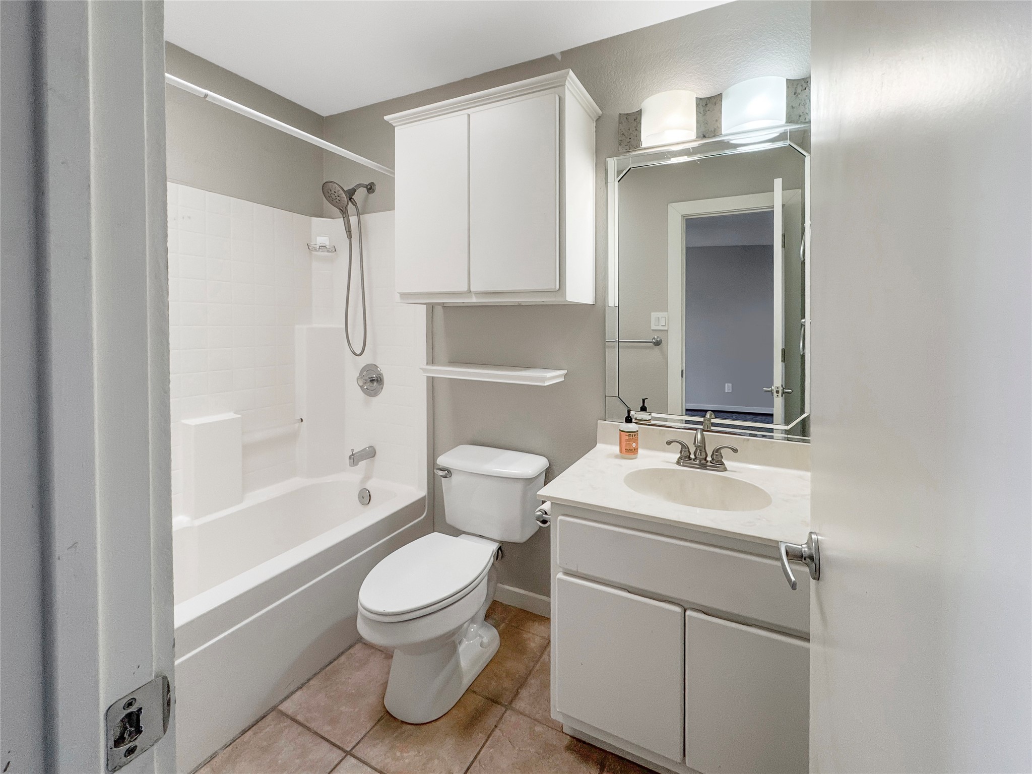 2114 Goodrich Avenue, Unit 4 Austin, TX 78704 - Photo 17 of 24 a bathroom with a toilet sink and mirror
