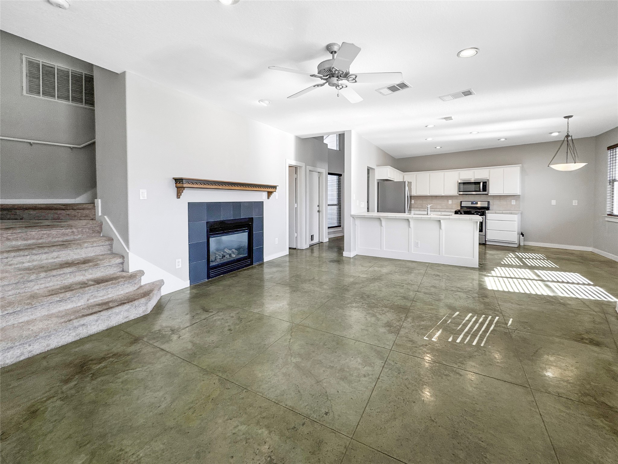 2114 Goodrich Avenue, Unit 4 Austin, TX 78704 - Photo 5 of 24 a view of a livingroom with a fireplace and chandelier