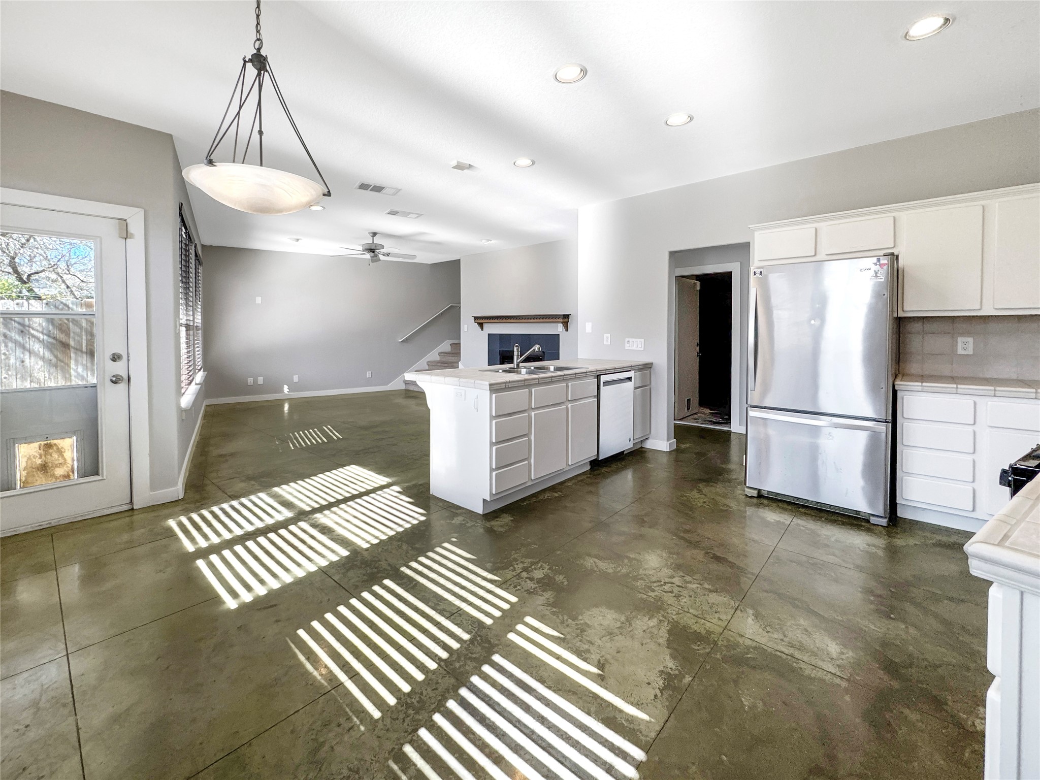 2114 Goodrich Avenue, Unit 4 Austin, TX 78704 - Photo 7 of 24 a kitchen with granite countertop a refrigerator oven a sink and a stove