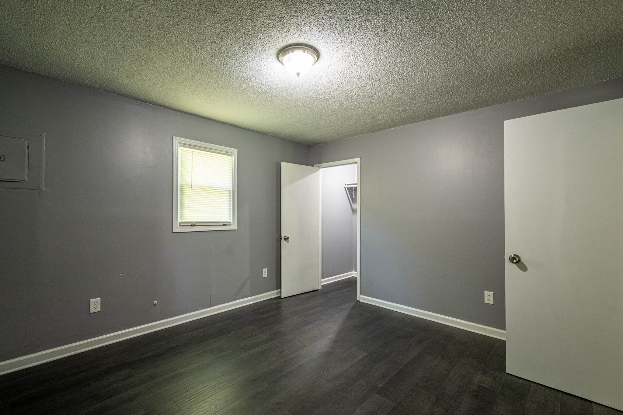 500 Bodenham Road Pulaski, TN 38478 - Photo 13 of 70 an empty room with wooden floor and windows