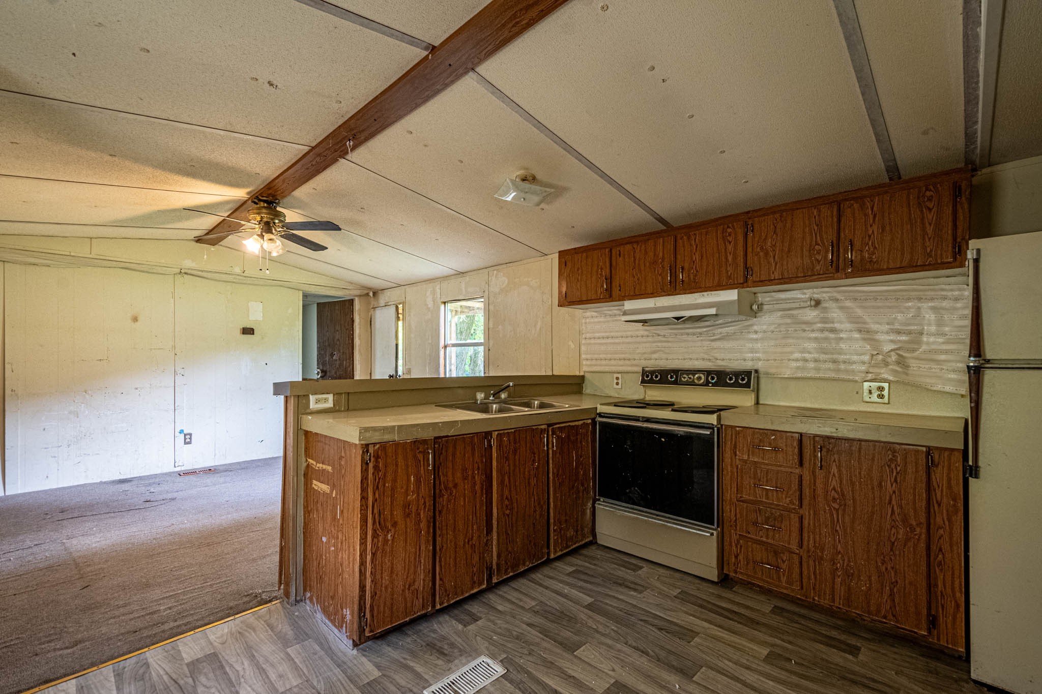 500 Bodenham Road Pulaski, TN 38478 - Photo 35 of 70 a kitchen with wooden cabinets and sink