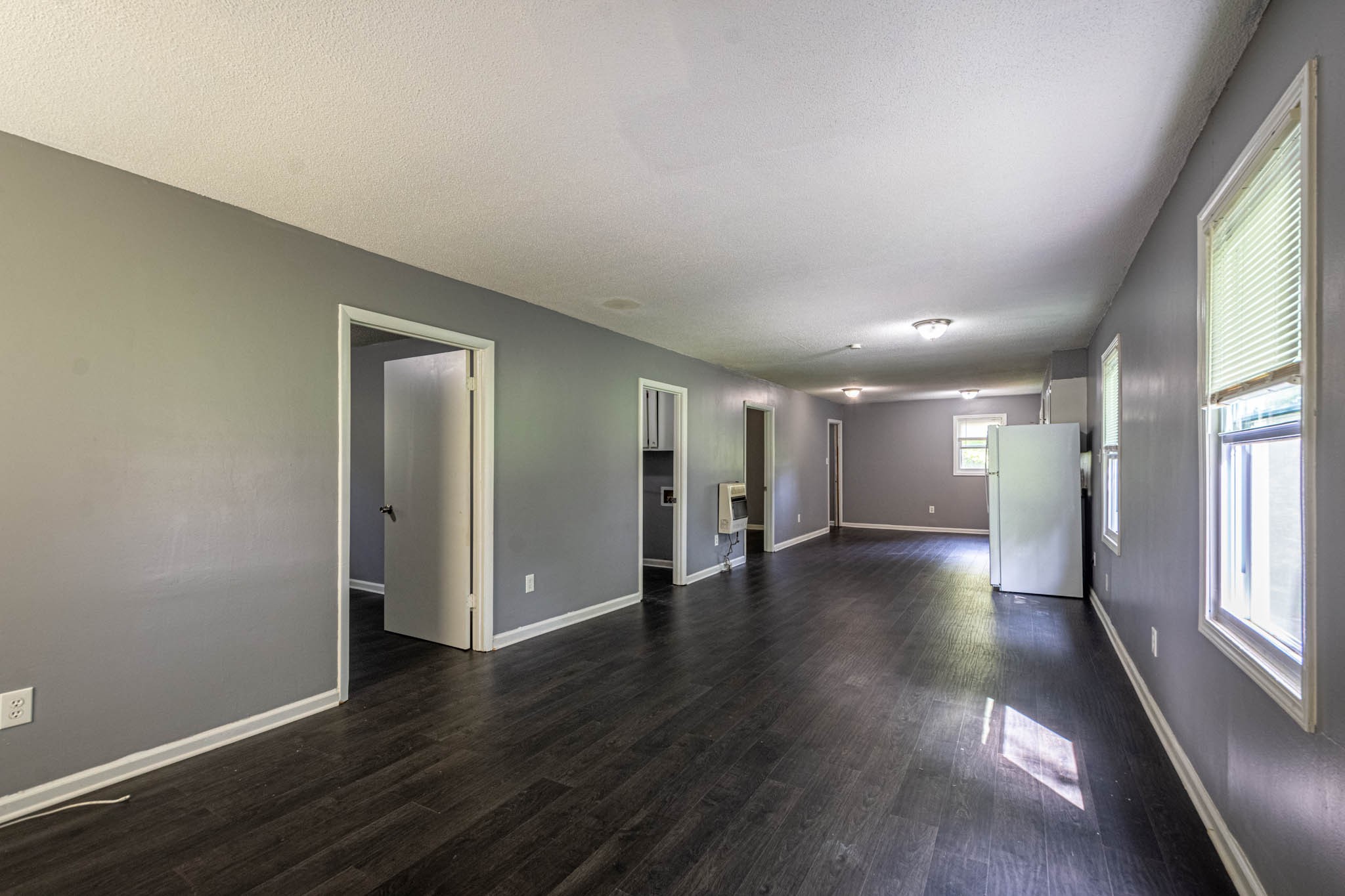 500 Bodenham Road Pulaski, TN 38478 - Photo 4 of 70 an empty room with wooden floor and windows