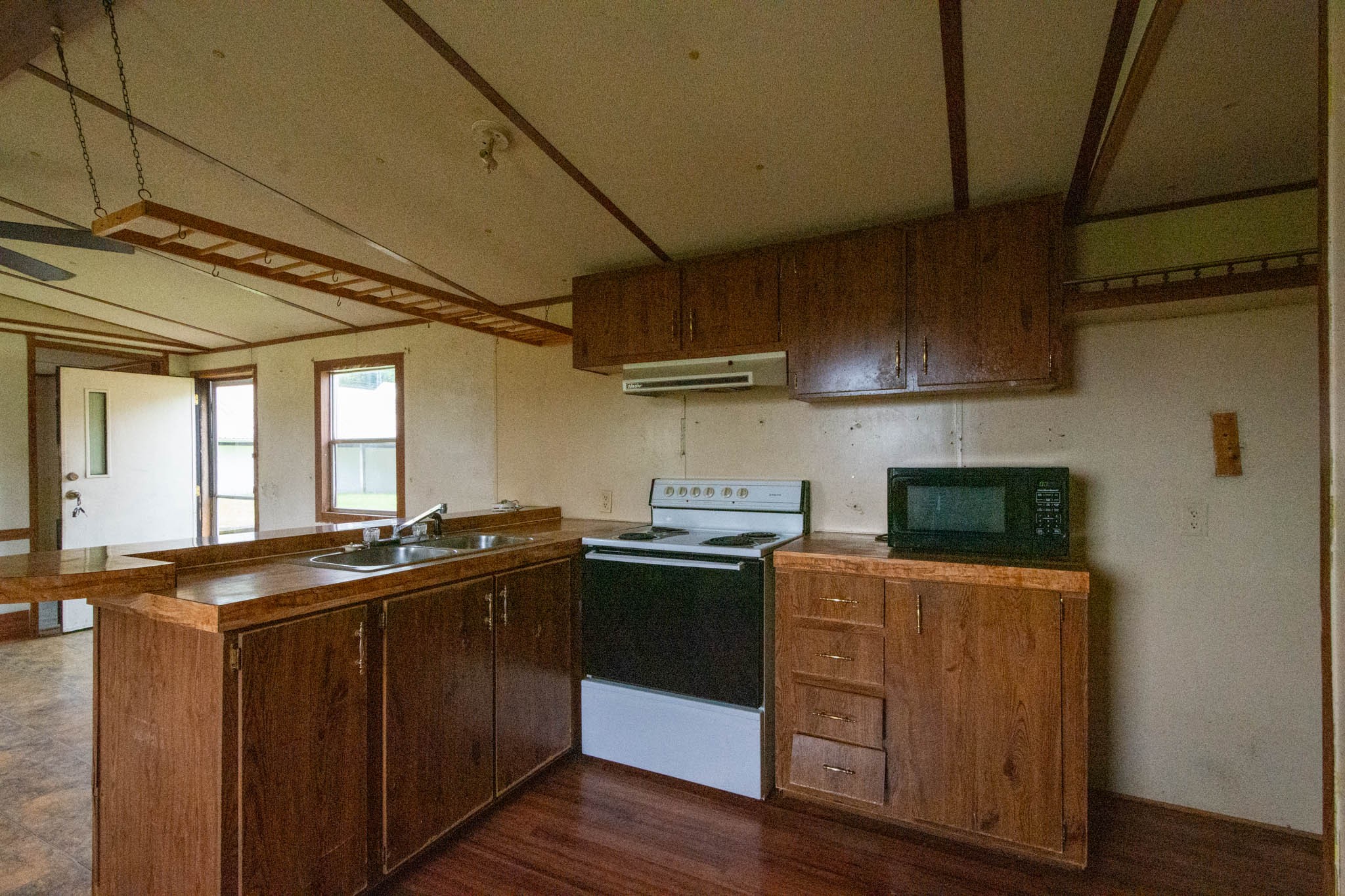 500 Bodenham Road Pulaski, TN 38478 - Photo 54 of 70 a kitchen with stainless steel appliances granite countertop a sink a stove and wooden cabinets
