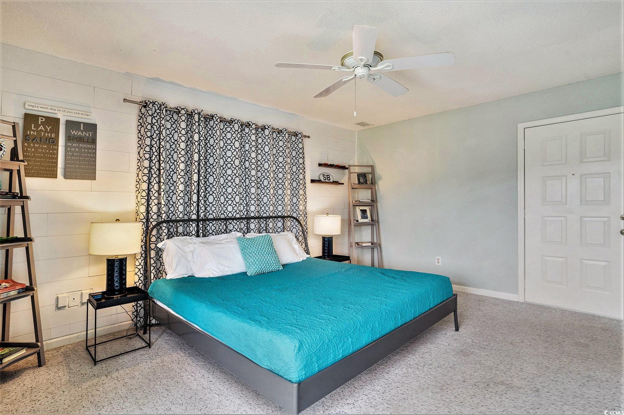 815 Colony Place, Unit 15F Sunset Beach, NC 28468 - Photo 13 of 34 Bedroom with baseboards and ceiling fan