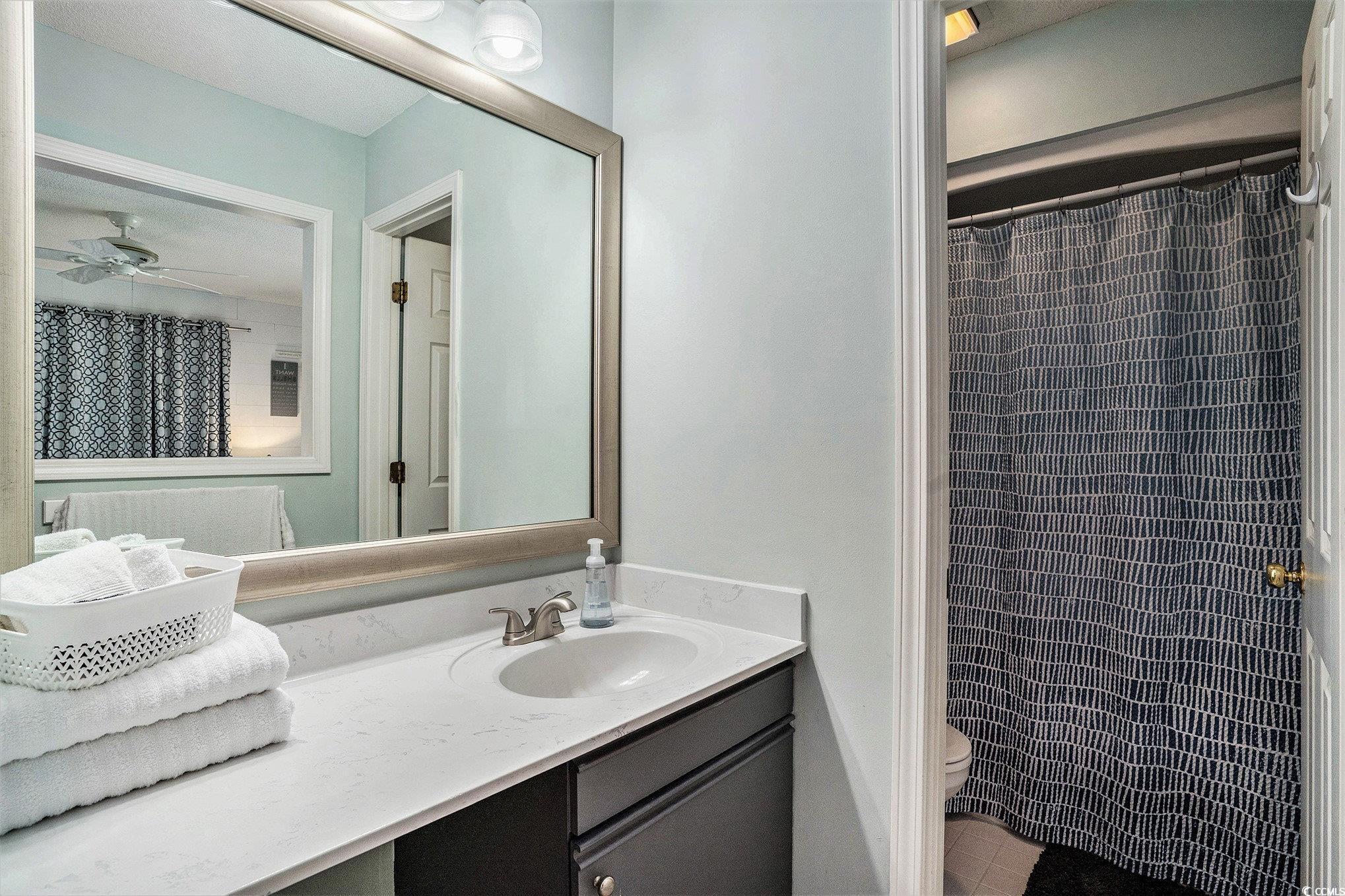 815 Colony Place, Unit 15F Sunset Beach, NC 28468 - Photo 15 of 34 Full bath with vanity and curtained shower
