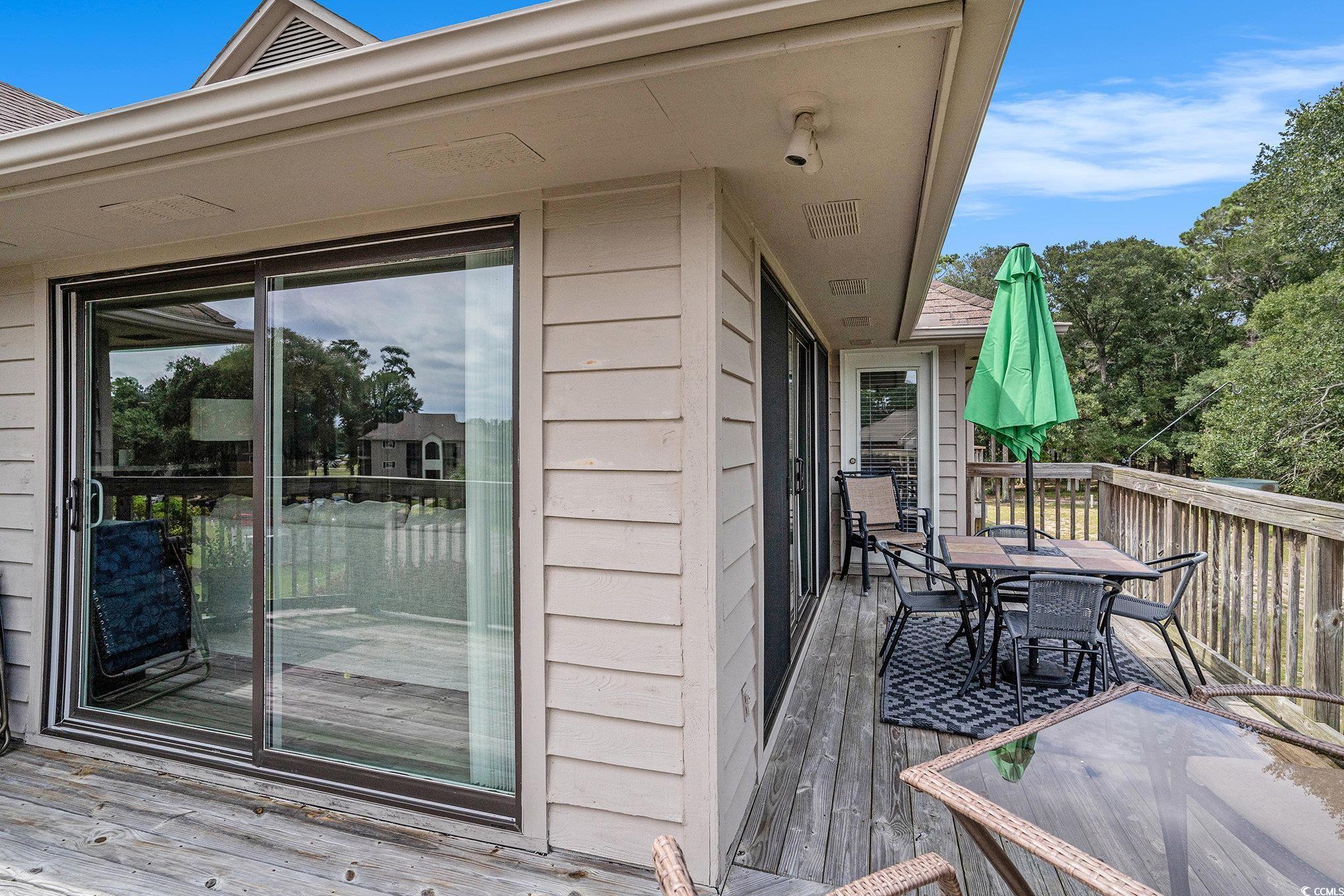 815 Colony Place, Unit 15F Sunset Beach, NC 28468 - Photo 19 of 34 Deck featuring outdoor dining area