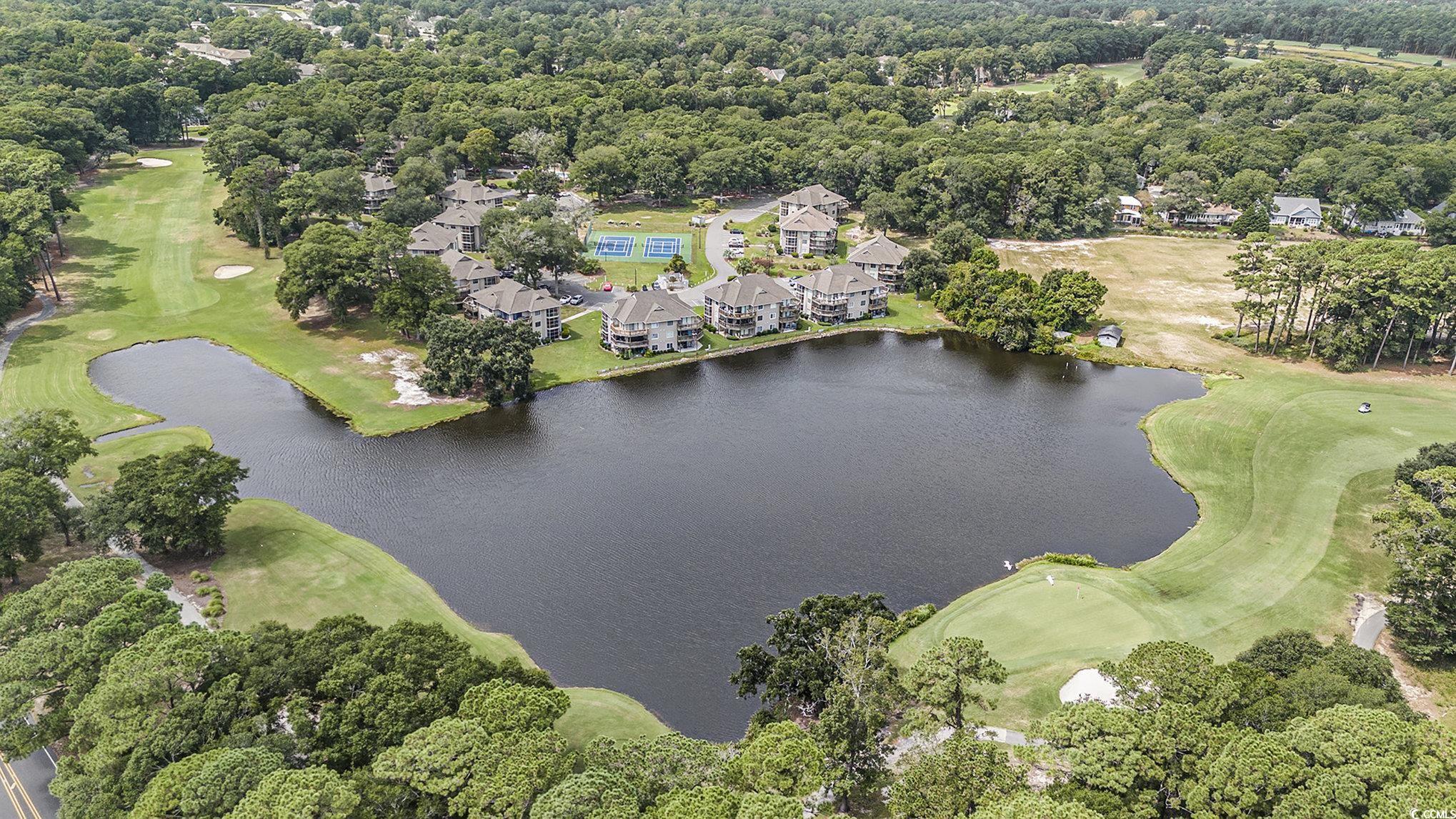 815 Colony Place, Unit 15F Sunset Beach, NC 28468 - Photo 26 of 34 View of property location with a golf club and a tree filled landscape