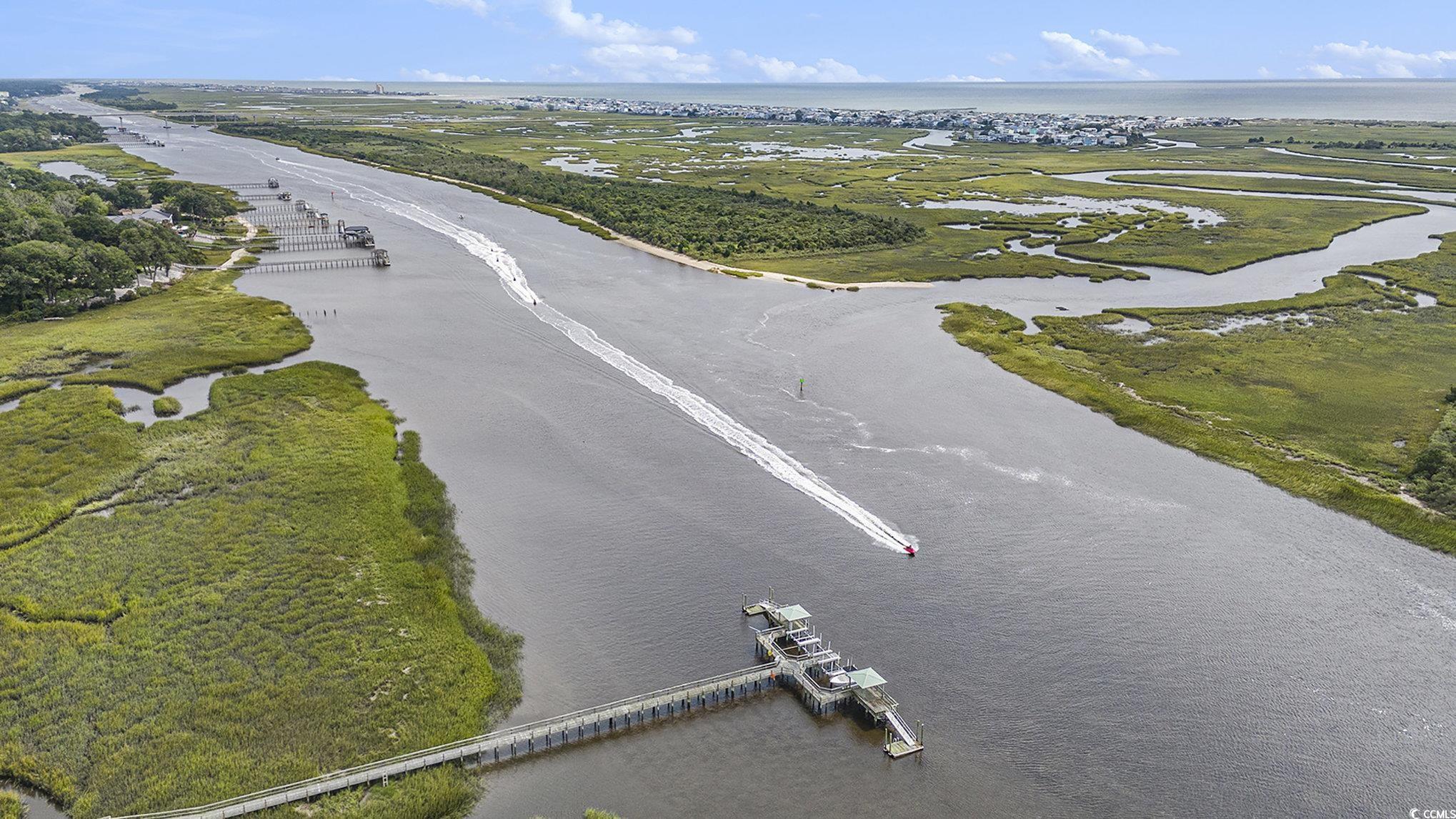 815 Colony Place, Unit 15F Sunset Beach, NC 28468 - Photo 29 of 34 Aerial view of a nearby body of water