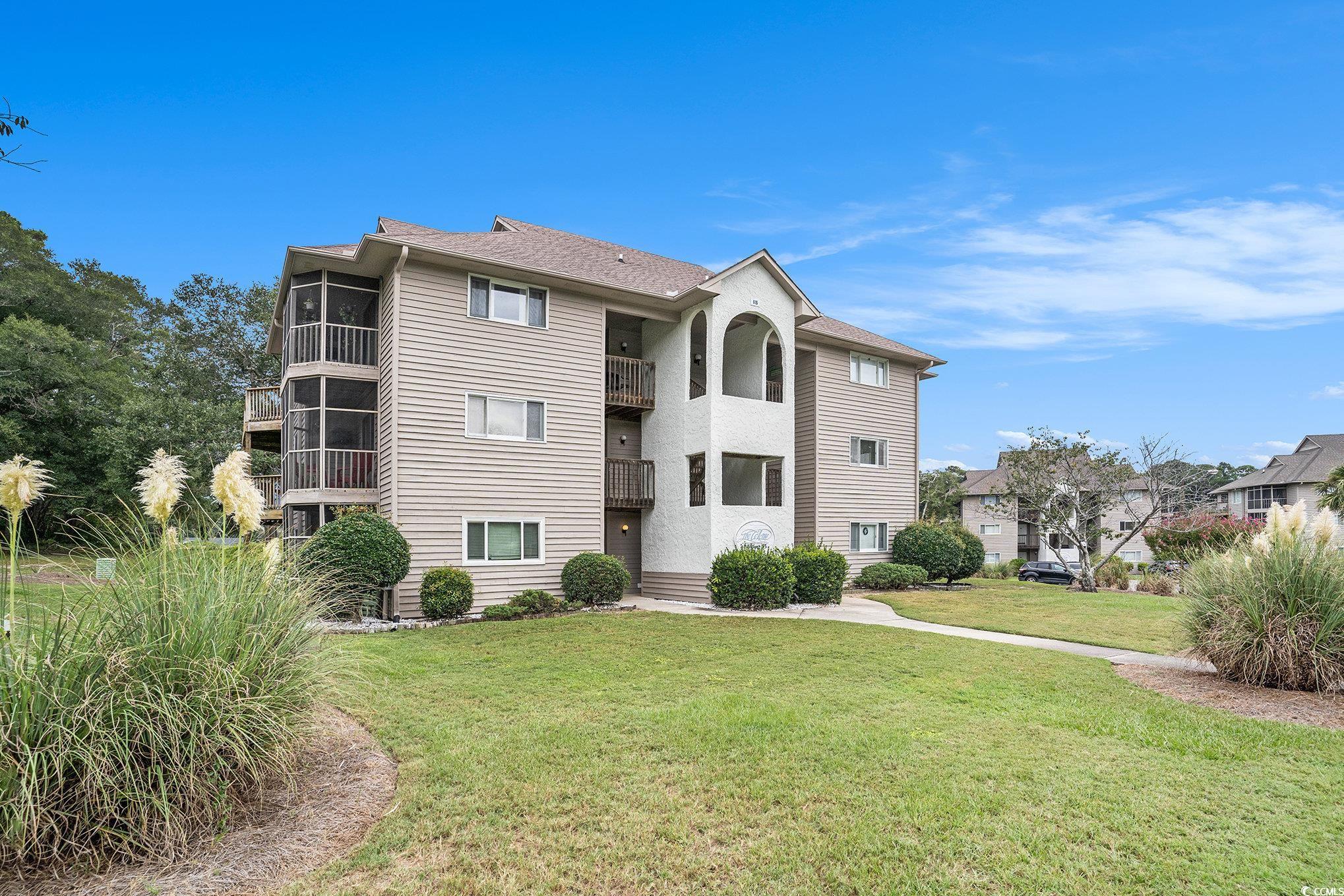 815 Colony Place, Unit 15F Sunset Beach, NC 28468 - Photo 30 of 34 View of building exterior