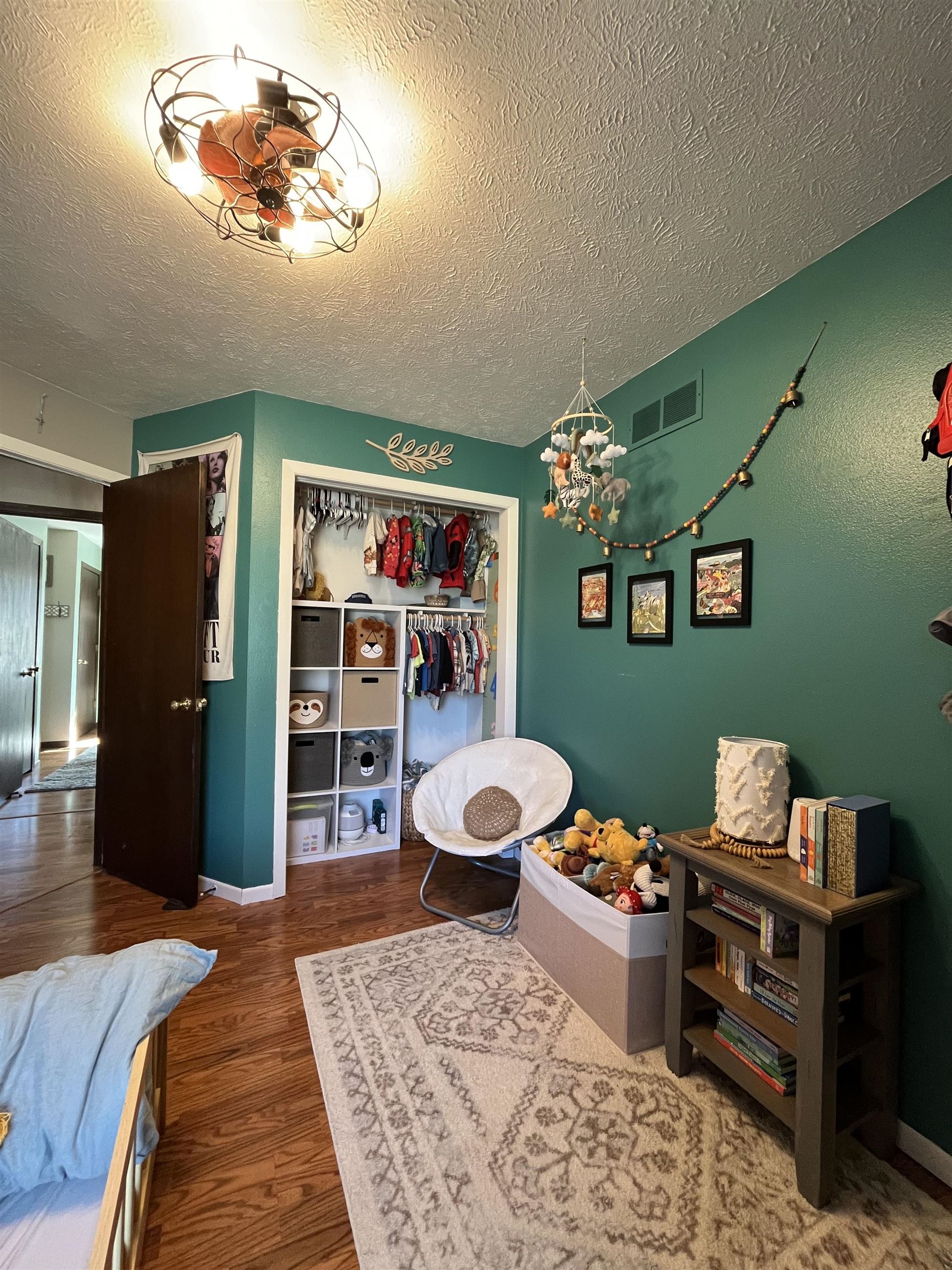 300 Lamplighter Loop Southeast Poplar Grove, IL 61065 - Photo 12 of 29 a bed room with a bed and a bookshelf