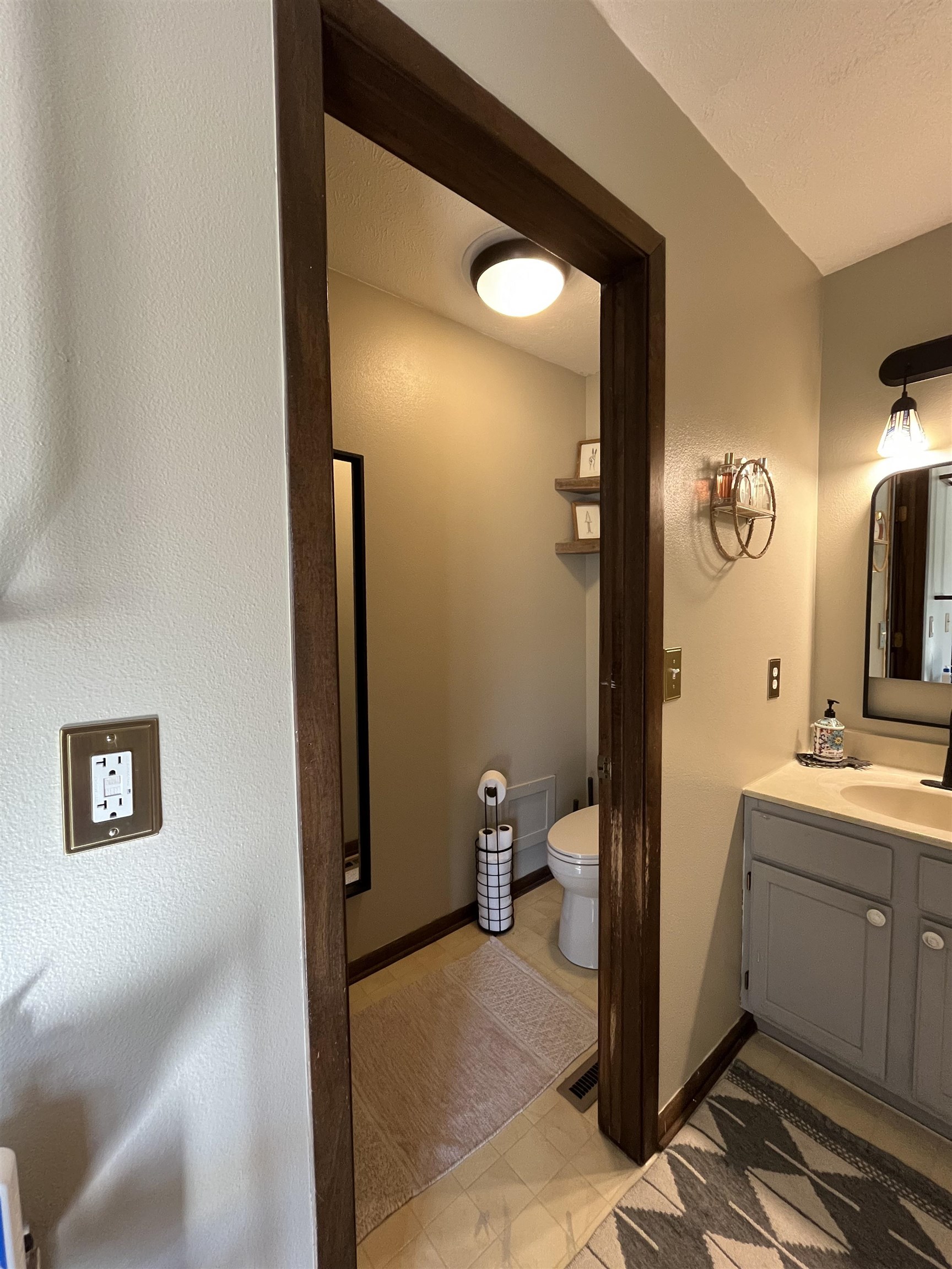 300 Lamplighter Loop Southeast Poplar Grove, IL 61065 - Photo 15 of 29 a bathroom with a sink and a mirror