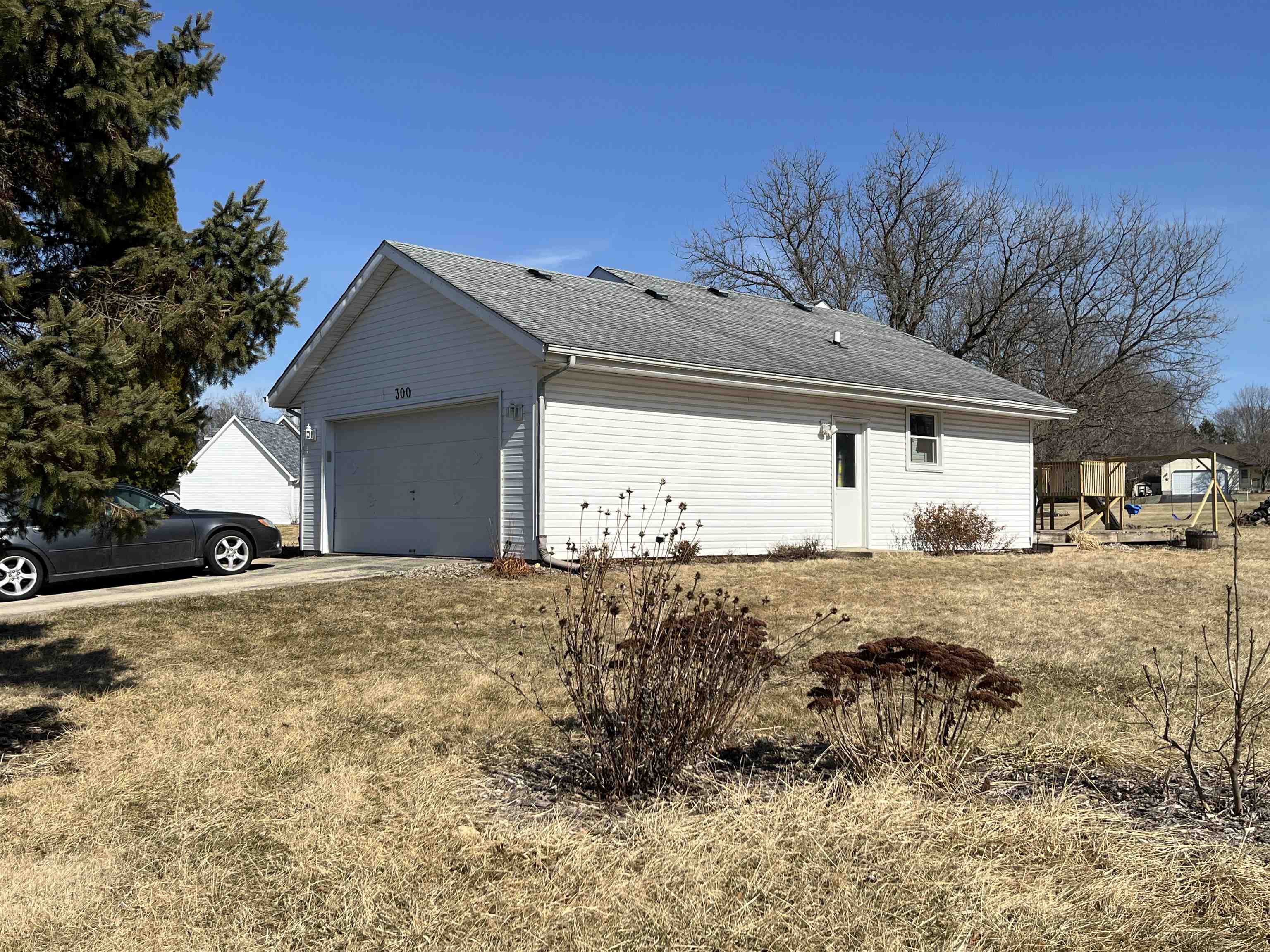 300 Lamplighter Loop Southeast Poplar Grove, IL 61065 - Photo 2 of 29 a view of a house with a yard covered in snow