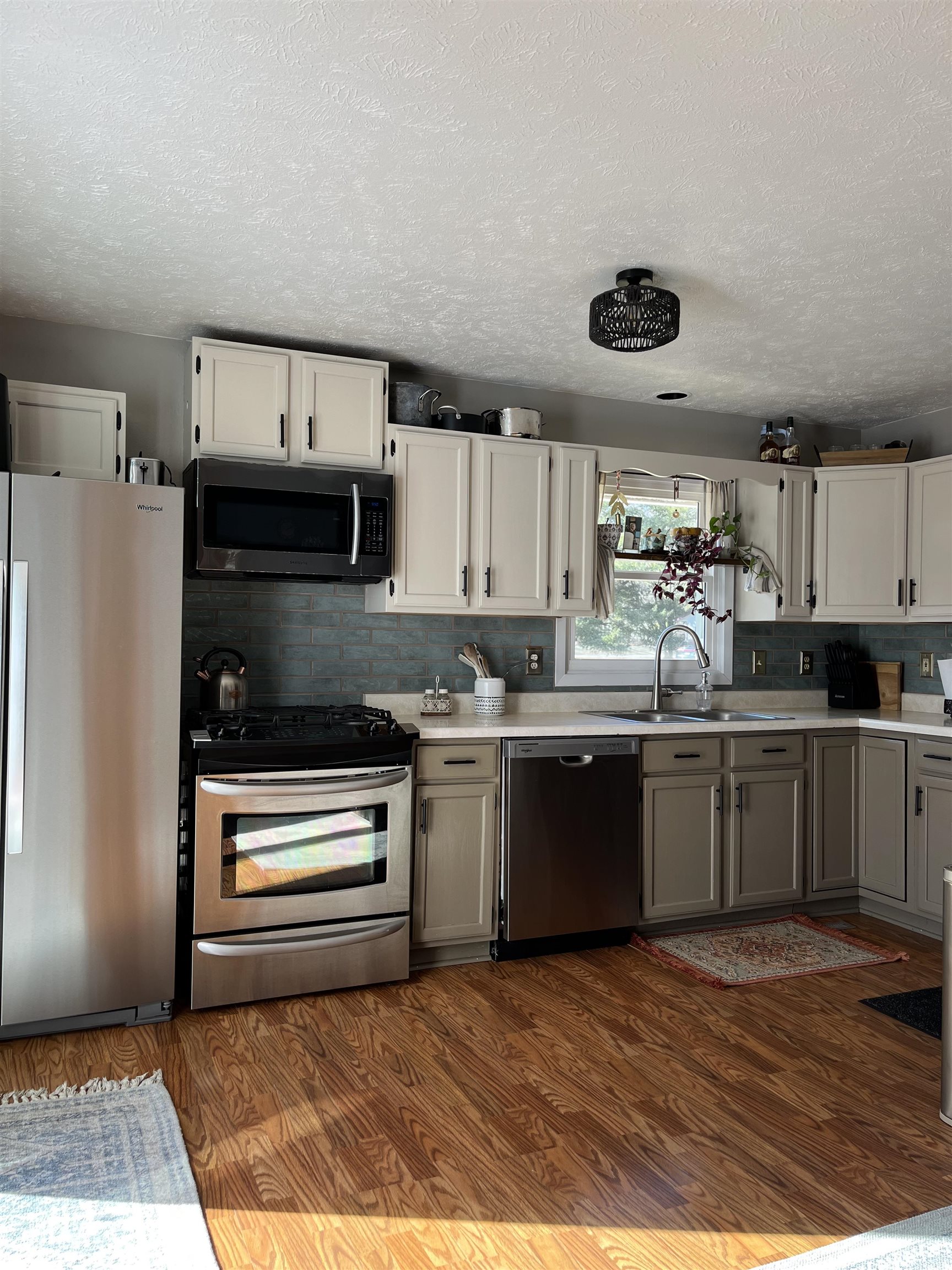300 Lamplighter Loop Southeast Poplar Grove, IL 61065 - Photo 24 of 29 a kitchen with stainless steel appliances granite countertop a refrigerator and a stove top oven