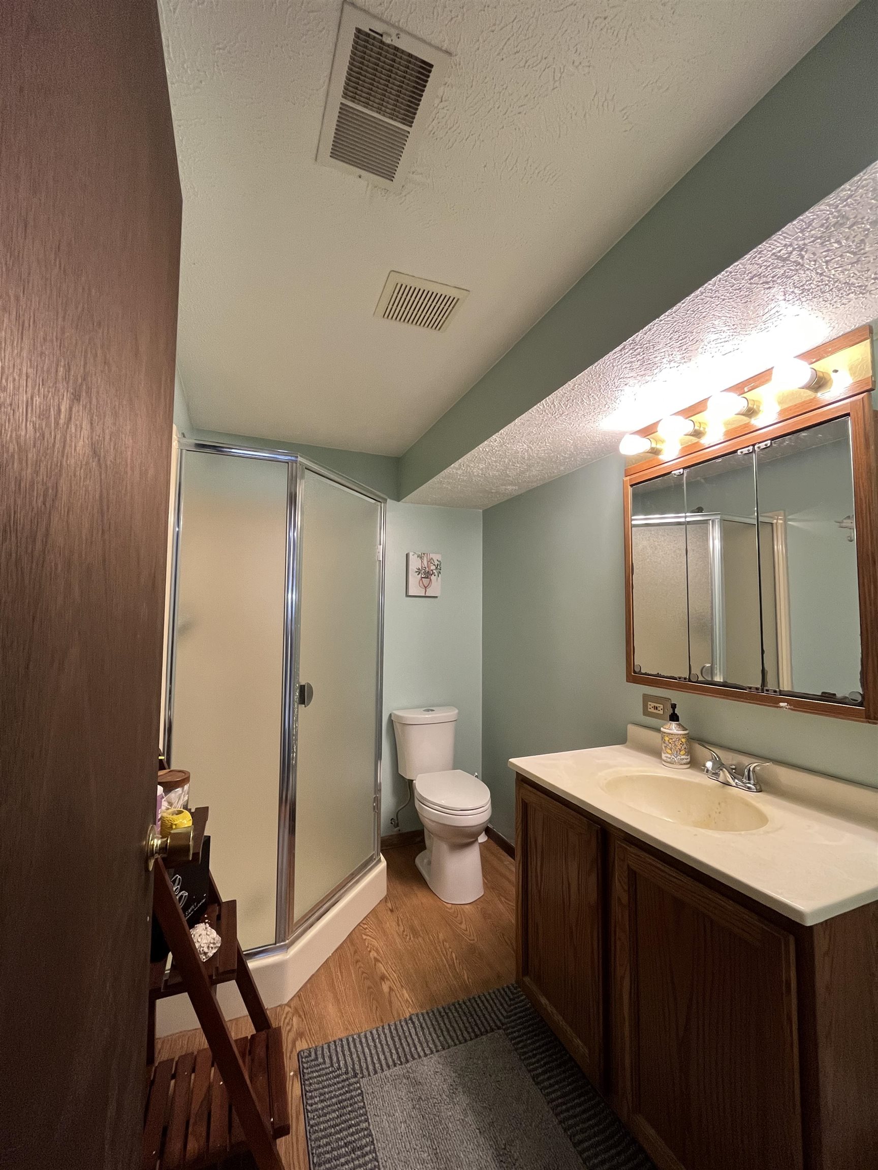300 Lamplighter Loop Southeast Poplar Grove, IL 61065 - Photo 6 of 29 a bathroom with a double vanity sink and mirror