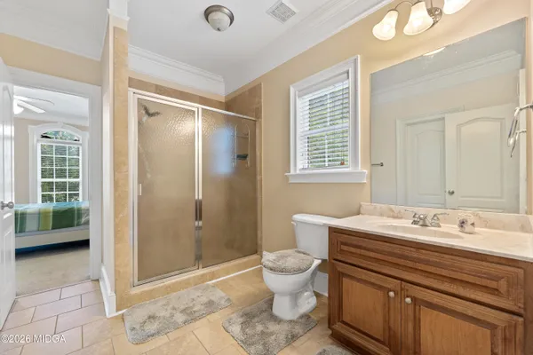 a kitchen with stainless steel appliances kitchen island granite countertop a refrigerator and cabinets