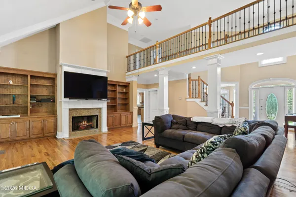 a living room with furniture and a flat screen tv