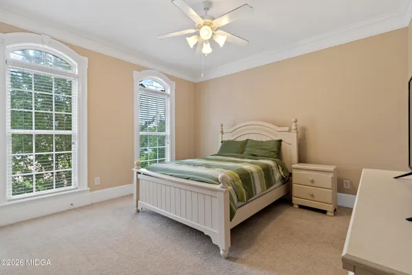 a kitchen with stainless steel appliances kitchen island granite countertop a refrigerator and a stove top oven