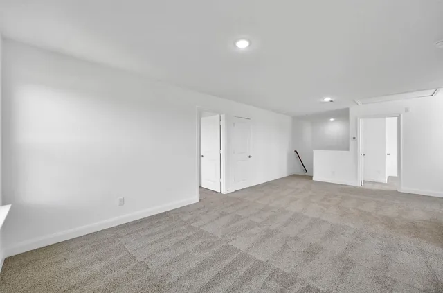 a view of a big room with white walls