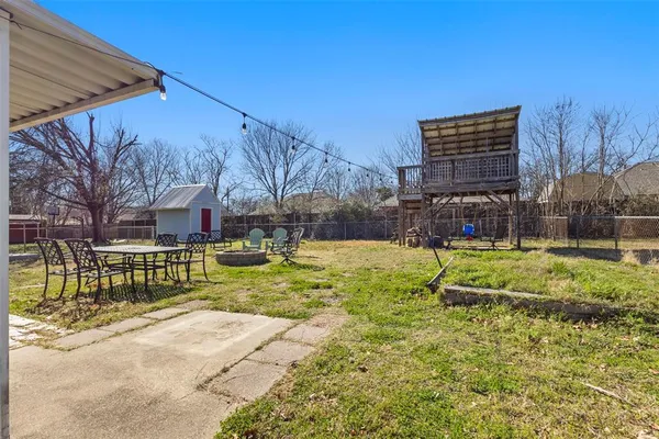 a view of backyard with swimming pool