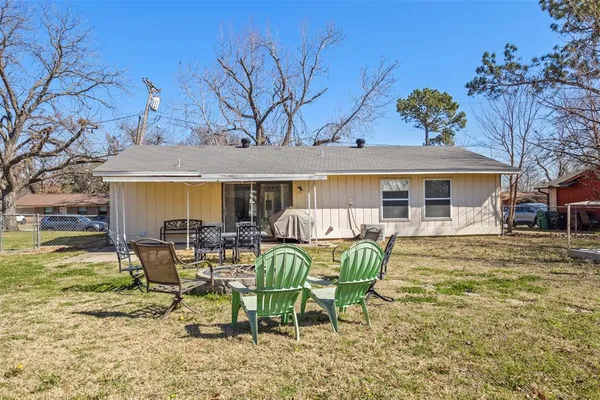a view of a house with backyard porch and sitting area