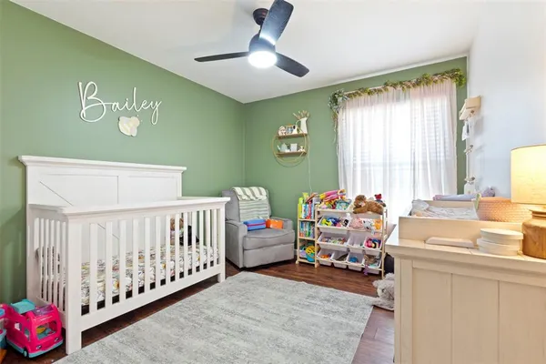 a bedroom with furniture and a window
