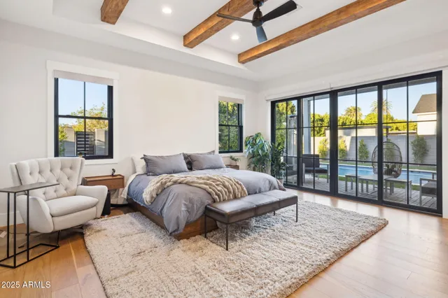 a spacious bathroom with a granite countertop double vanity sink a mirror and a