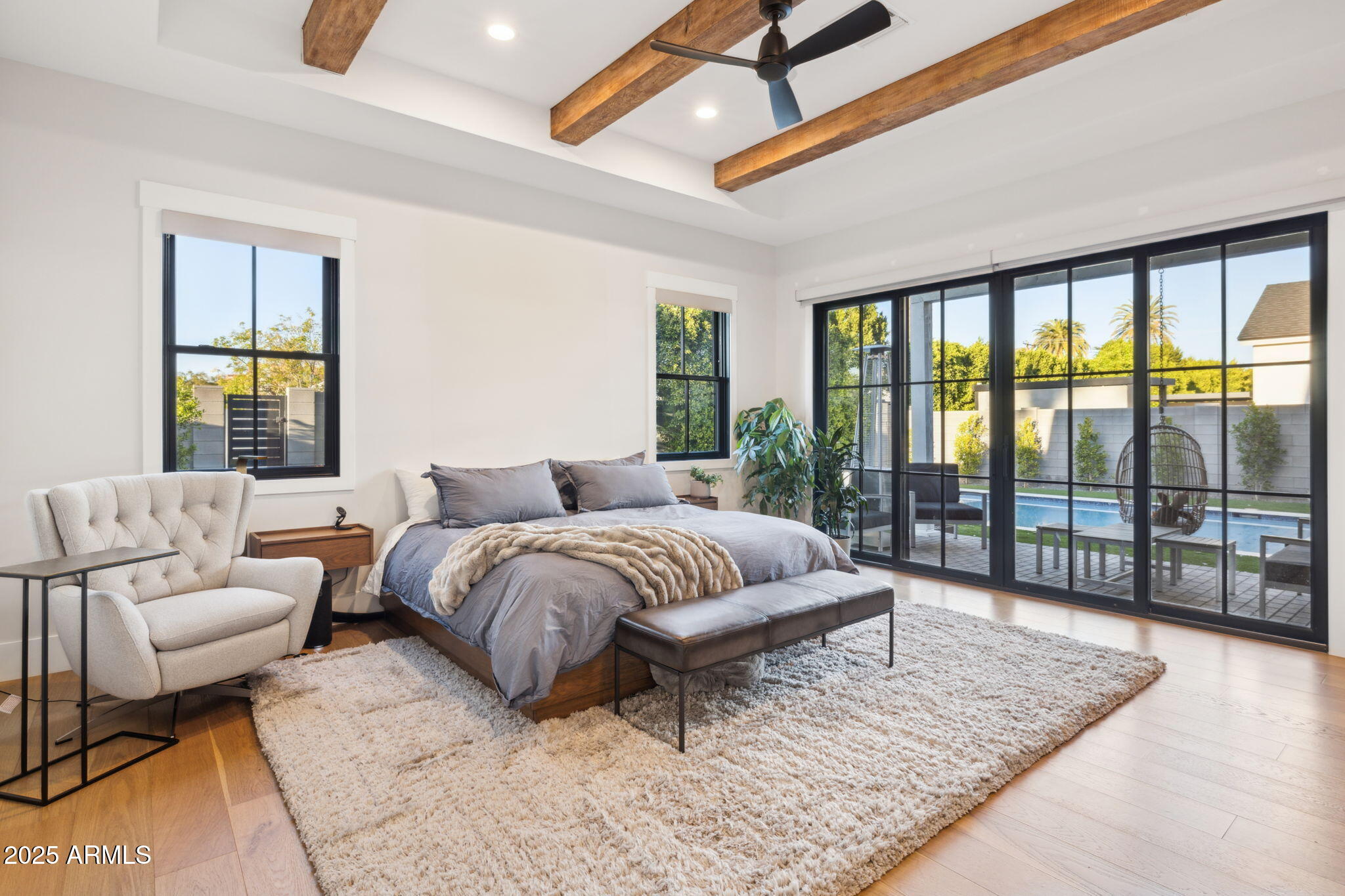 3530 East Glenrosa Avenue Phoenix, AZ 85018 - Photo 17 of 41 a spacious bedroom with a bed a couch and a large window
