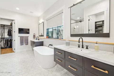 a bathroom with a shower and a sink