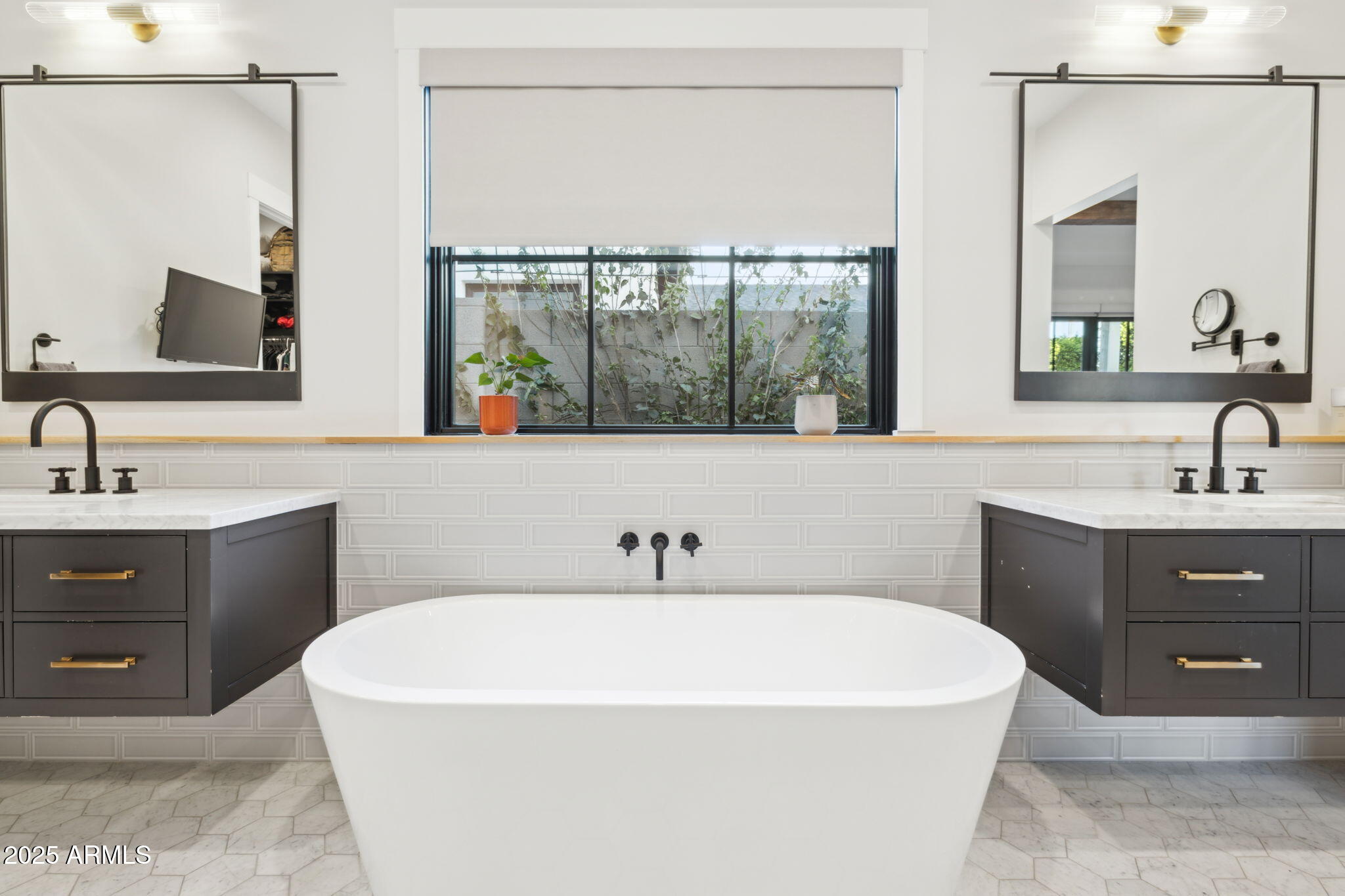 3530 East Glenrosa Avenue Phoenix, AZ 85018 - Photo 20 of 41 a bathroom with a sink and a mirror