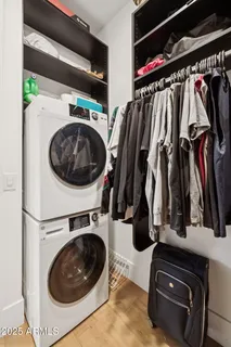 a bathroom with a sink vanity mirror and toilet