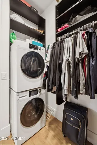 a bathroom with a sink vanity mirror and toilet