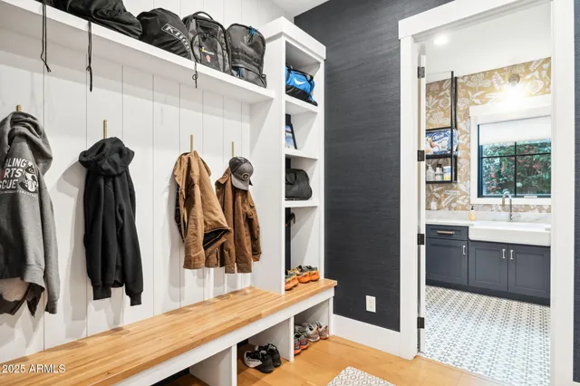 a bathroom with a sink a toilet and a shower curtain