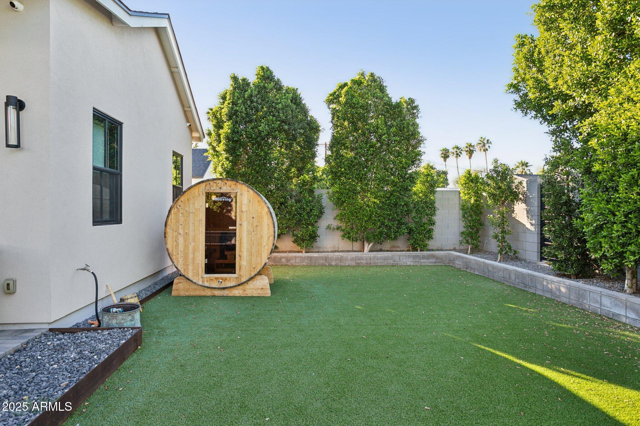 3530 East Glenrosa Avenue Phoenix, AZ 85018 - Photo 34 of 41 a backyard of a house with lots of green space