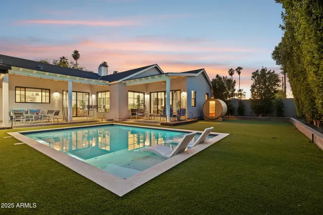a view of swimming pool with an outdoor seating