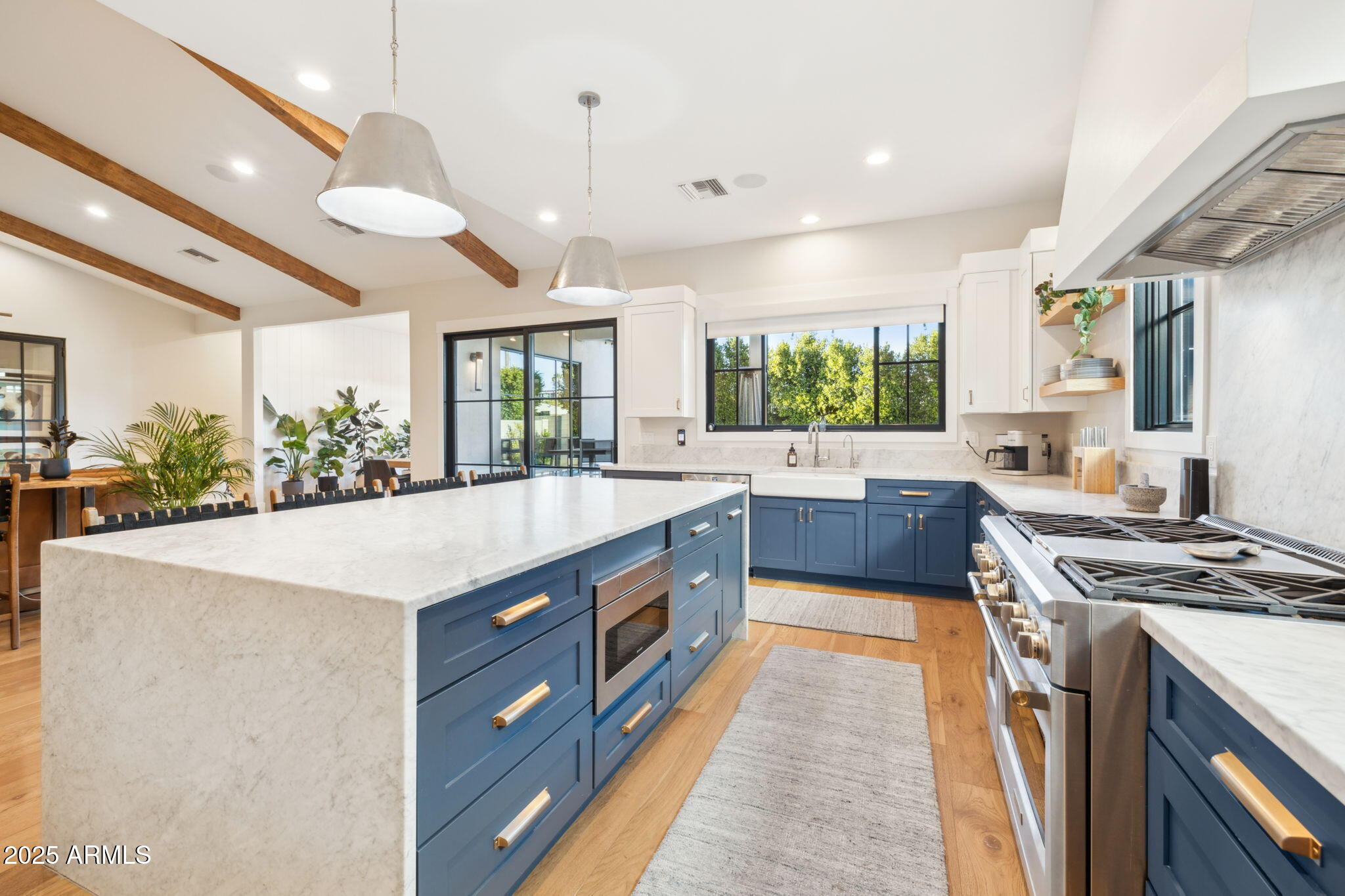 3530 East Glenrosa Avenue Phoenix, AZ 85018 - Photo 10 of 41 a large kitchen with stainless steel appliances granite countertop a stove a sink and a refrigerator