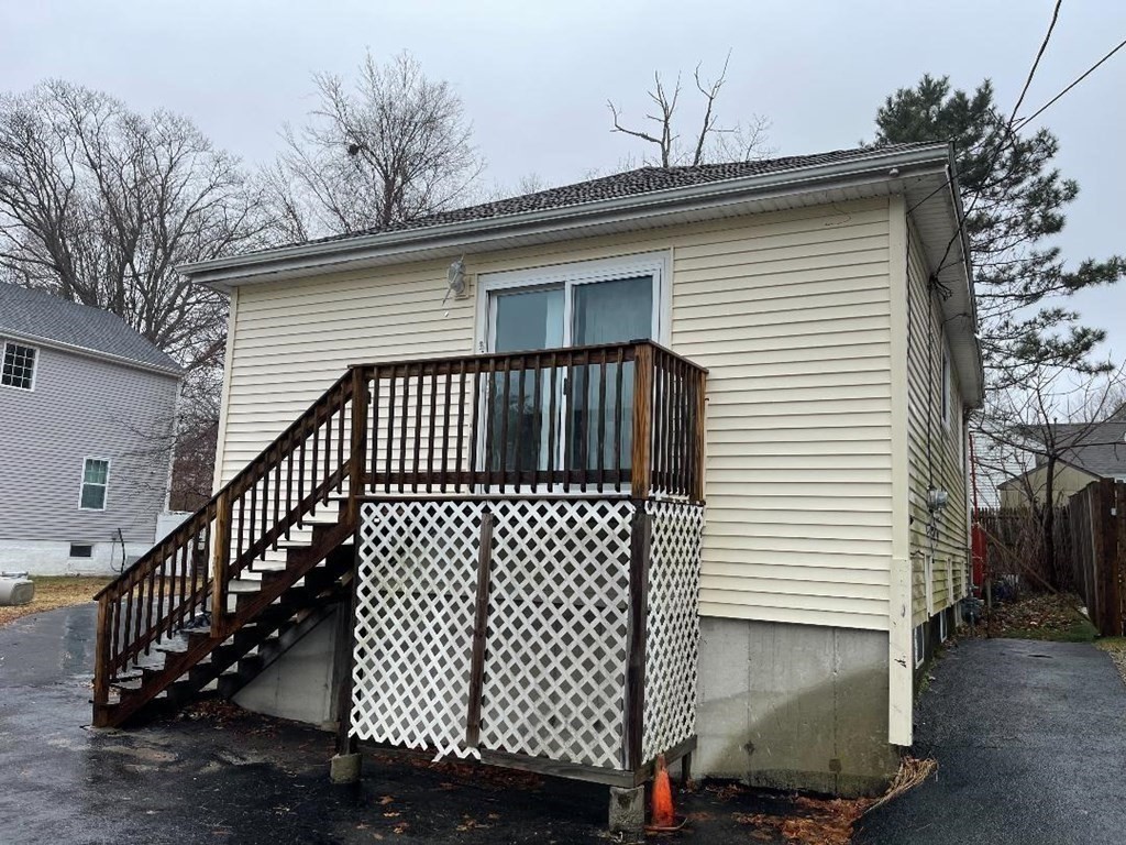 a front view of a house with wooden fence