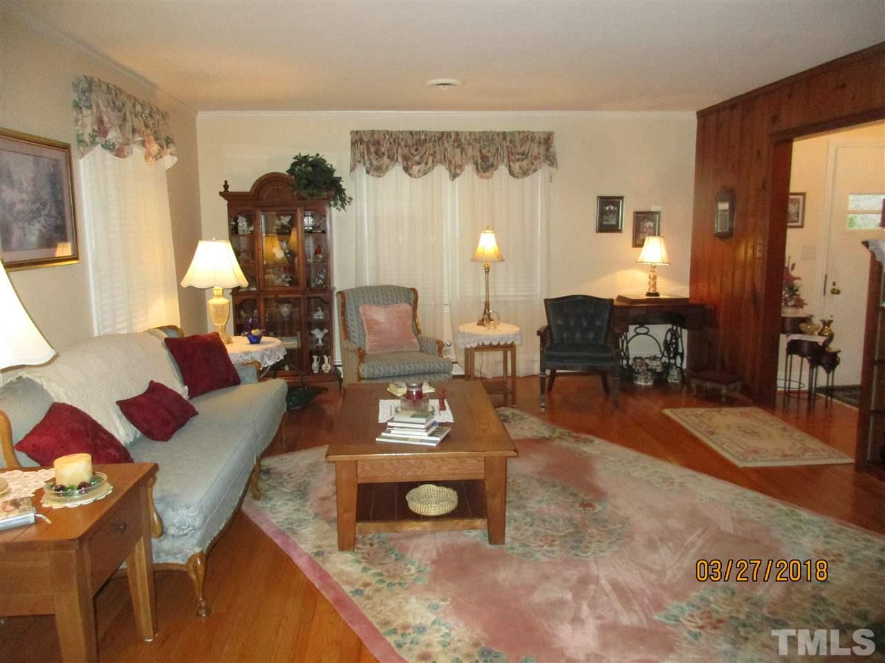511 Gordon Street Roxboro, NC 27573 - Photo 11 of 25 a living room with furniture and a table
