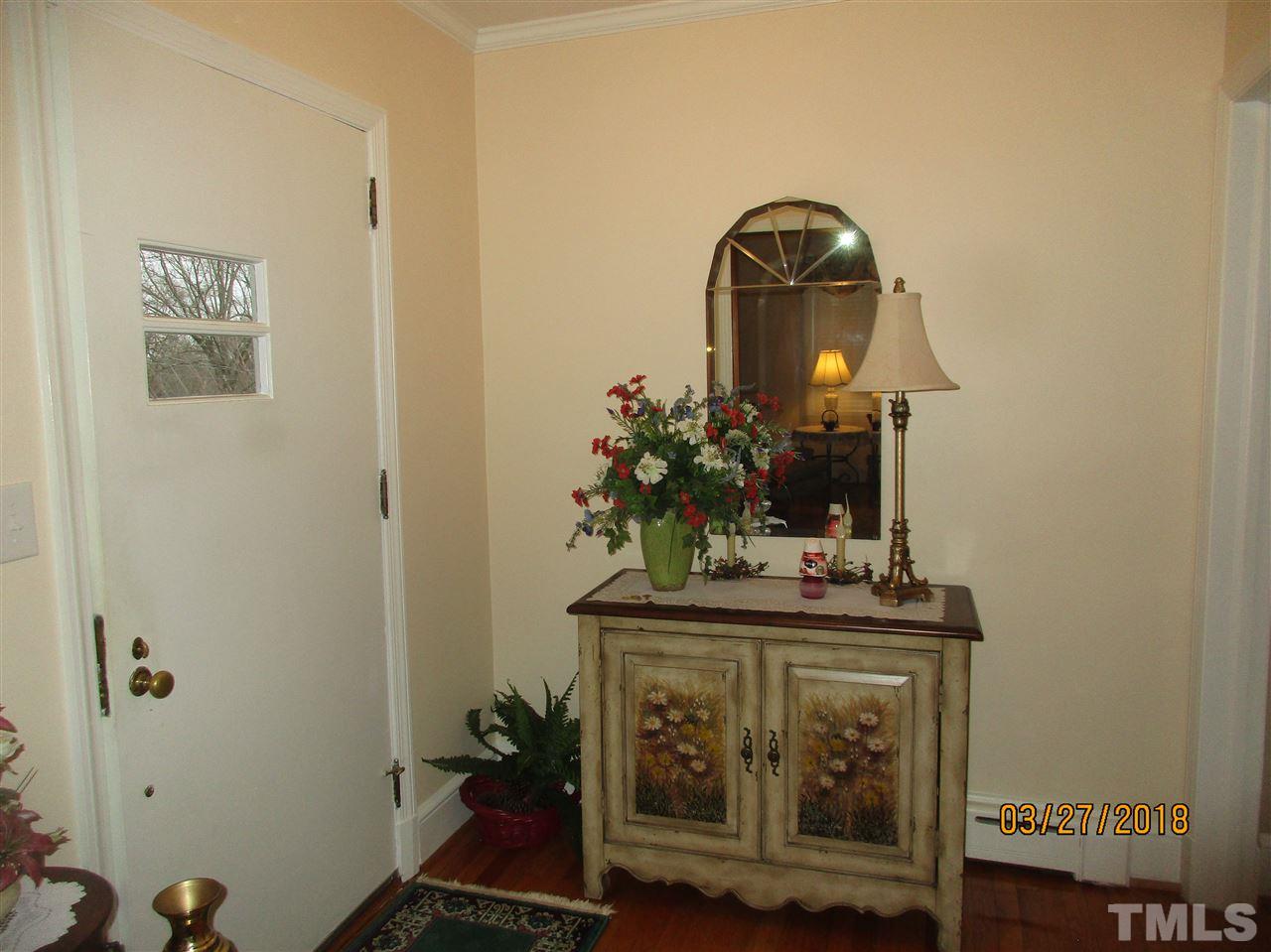 511 Gordon Street Roxboro, NC 27573 - Photo 14 of 25 a bathroom with a sink and a mirror