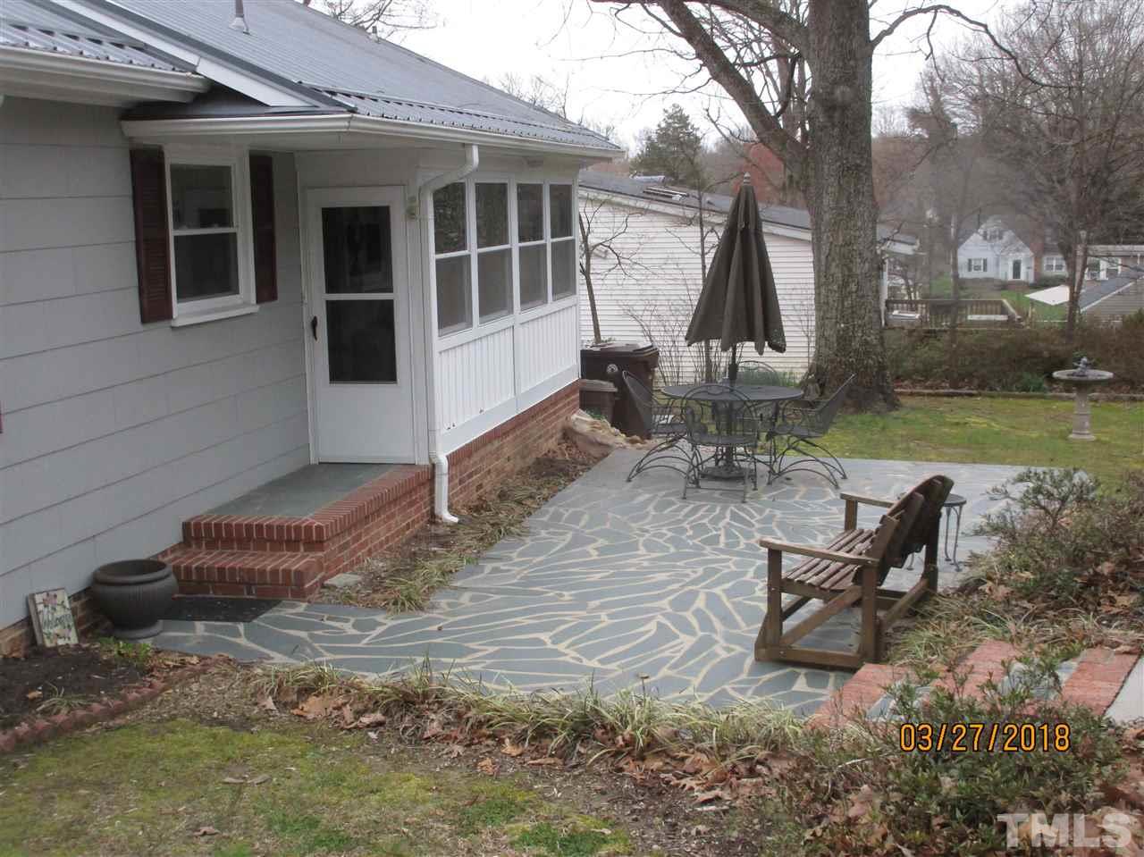 511 Gordon Street Roxboro, NC 27573 - Photo 20 of 25 a view of a house with backyard and sitting area