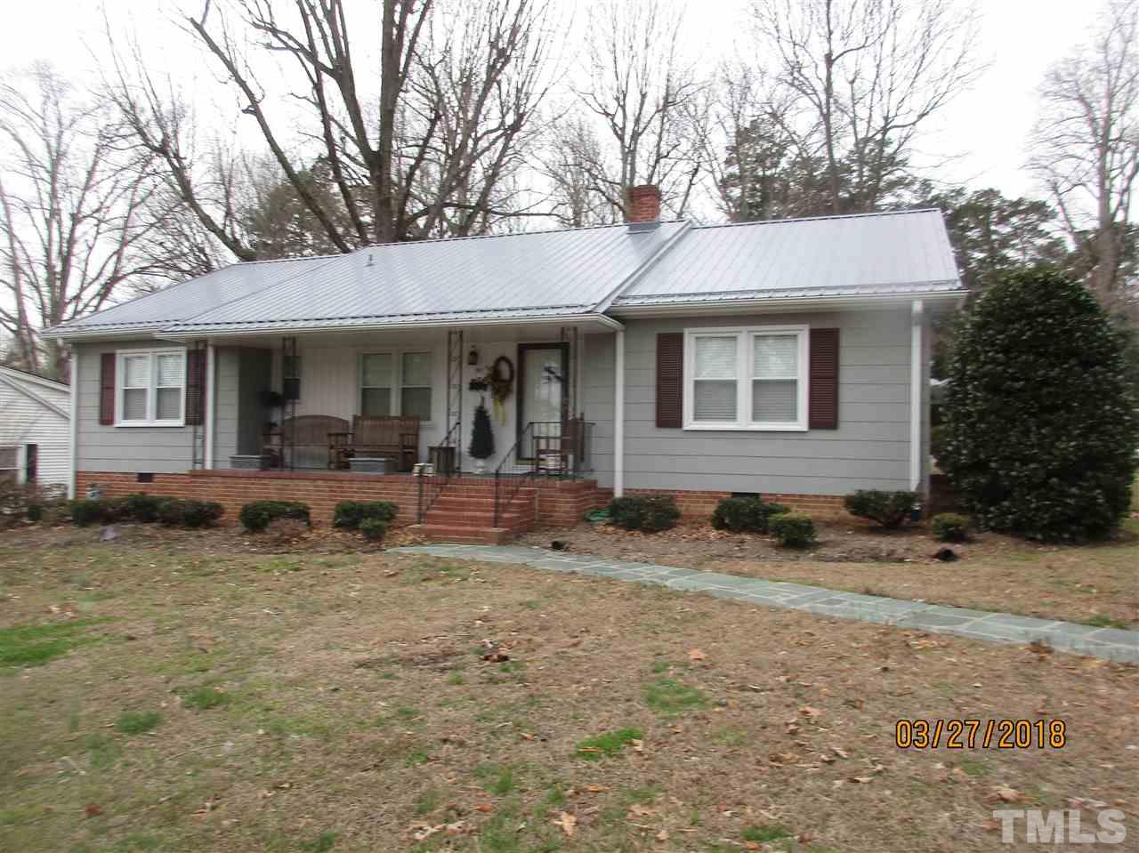 511 Gordon Street Roxboro, NC 27573 - Photo 3 of 25 a view of a house with a yard