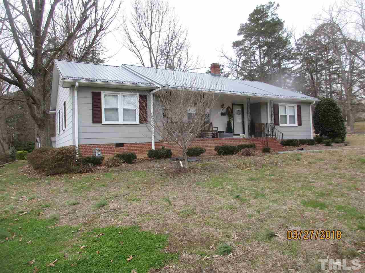 511 Gordon Street Roxboro, NC 27573 - Photo 4 of 25 a front view of a house with garden